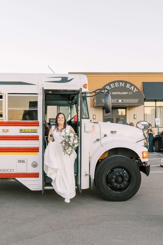 Bride exits Bash on Wheels bus at her Green Bay Distillery wedding reception.
