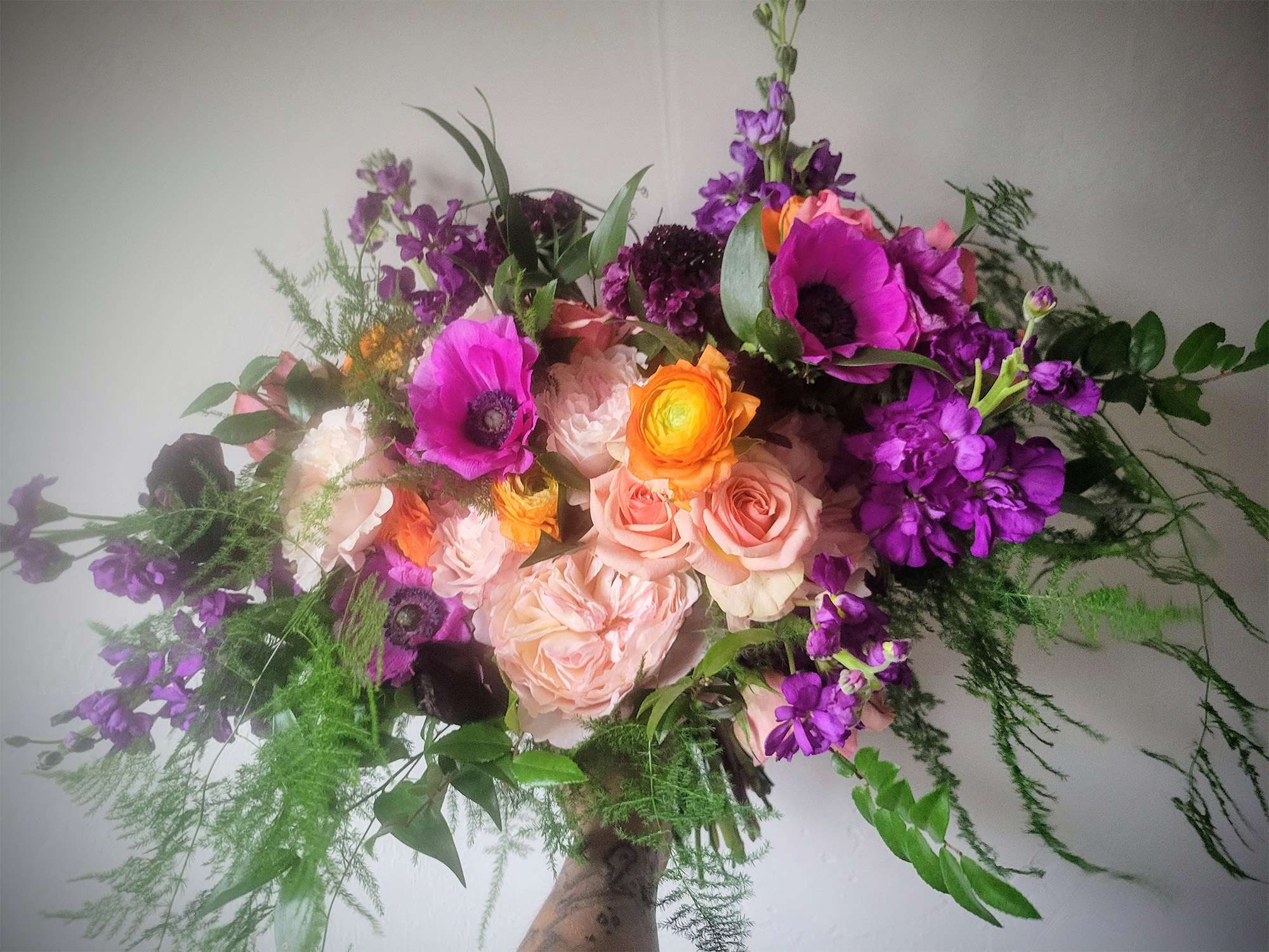 Bold hued bridal bouquet by Archer & Bliss Floral of Shawano, WI.