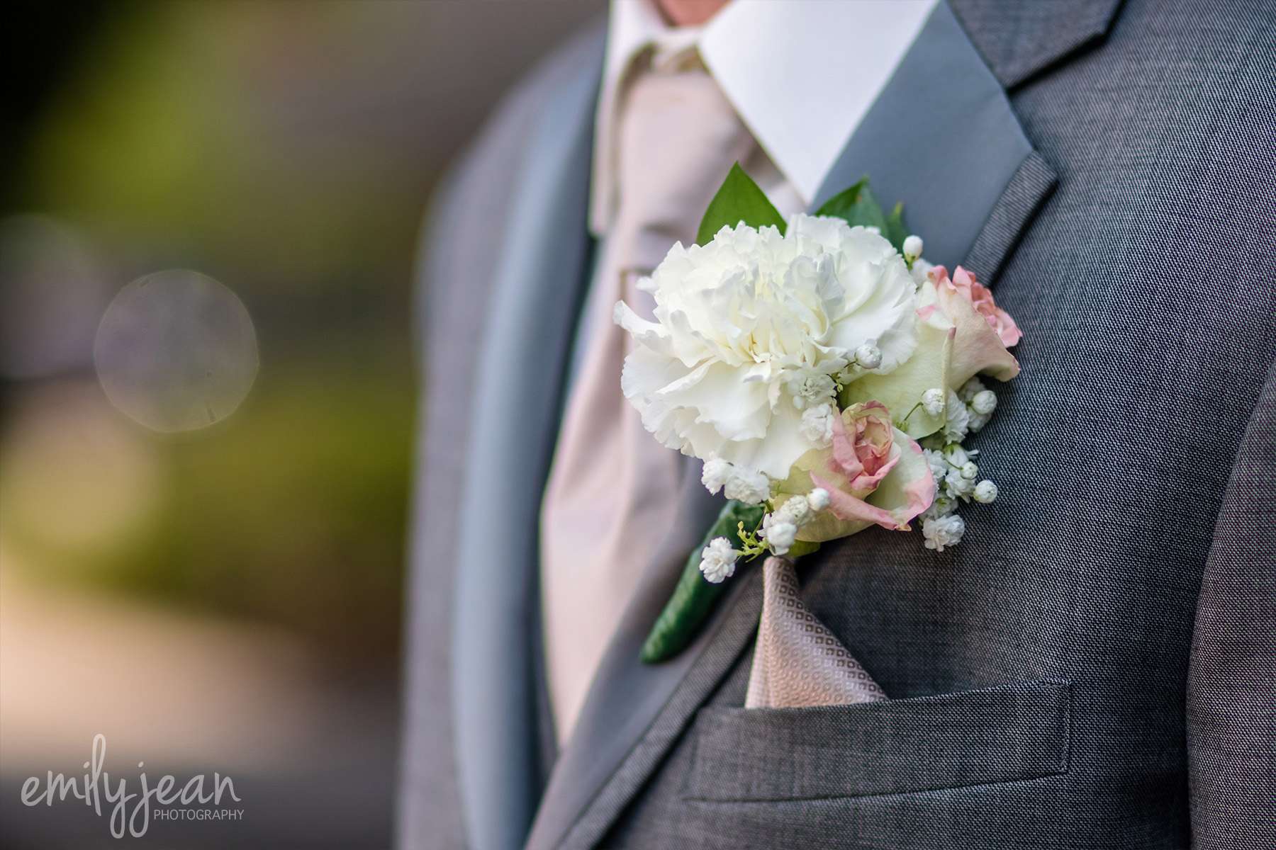 gray suit with boutonnière