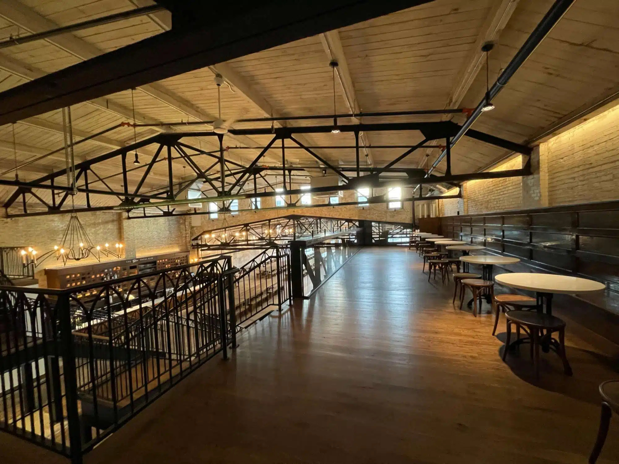 The mezzanine area with cafe tables at the Gibson Social Club in Oshkosh, WI