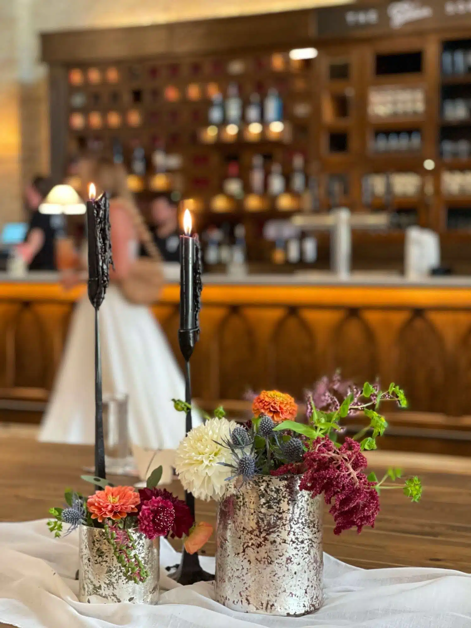 Bride standing at bar at the Gibson Social Club