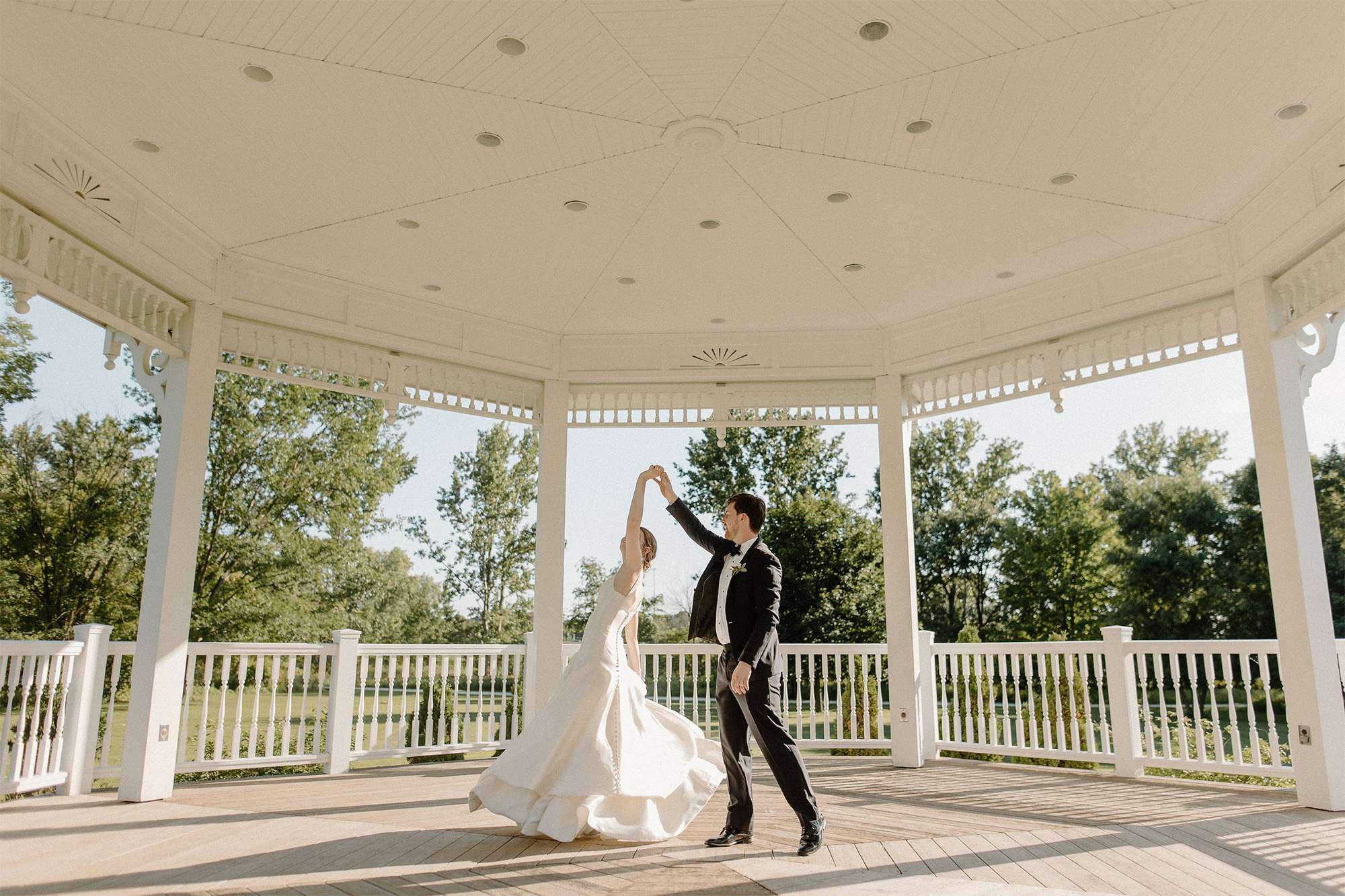 Bride and groom dance in gazebo at Heritage Hill State Historical Park in Green Bay.