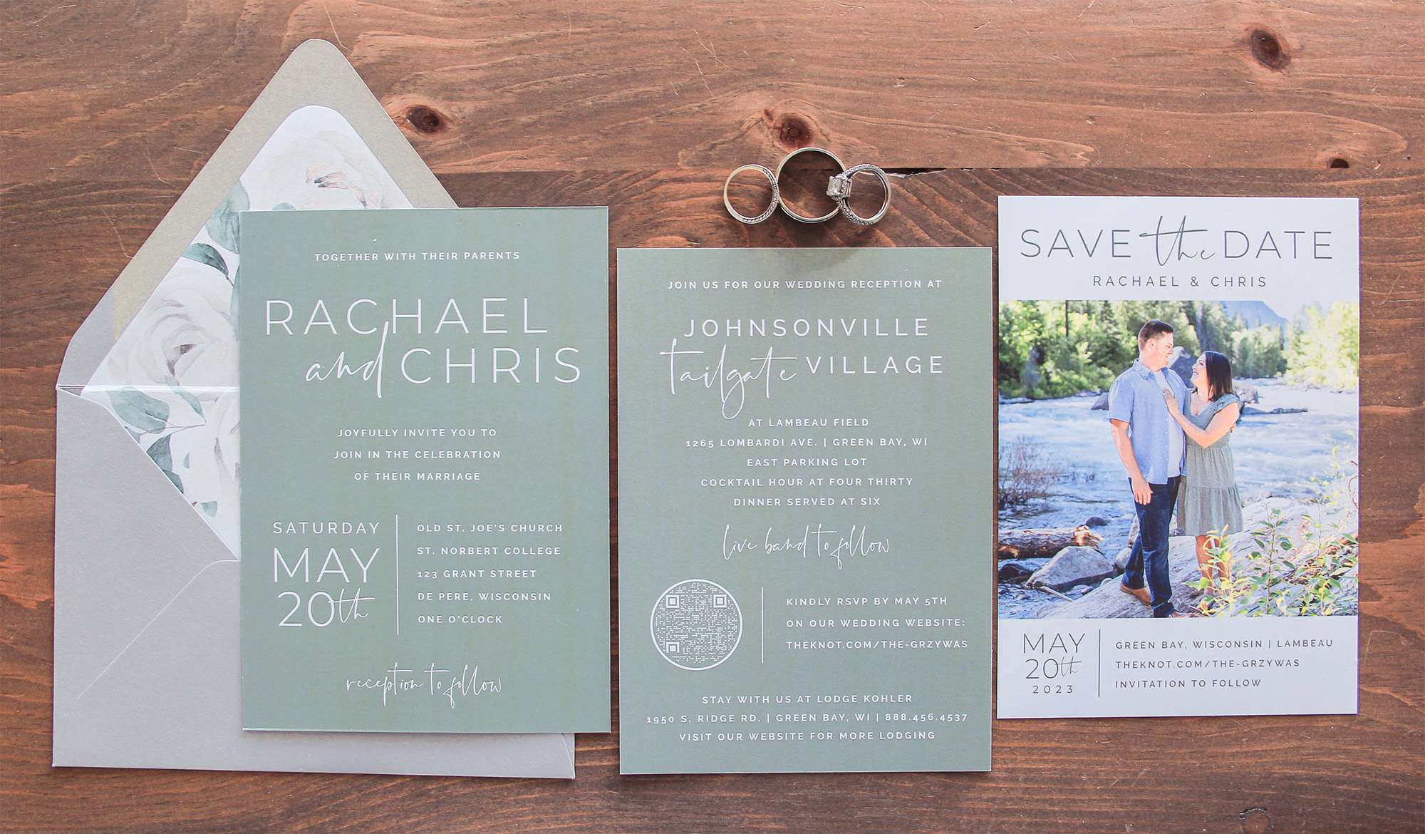 White Blossoms and sage wedding invitation and a Save the Date photo card.