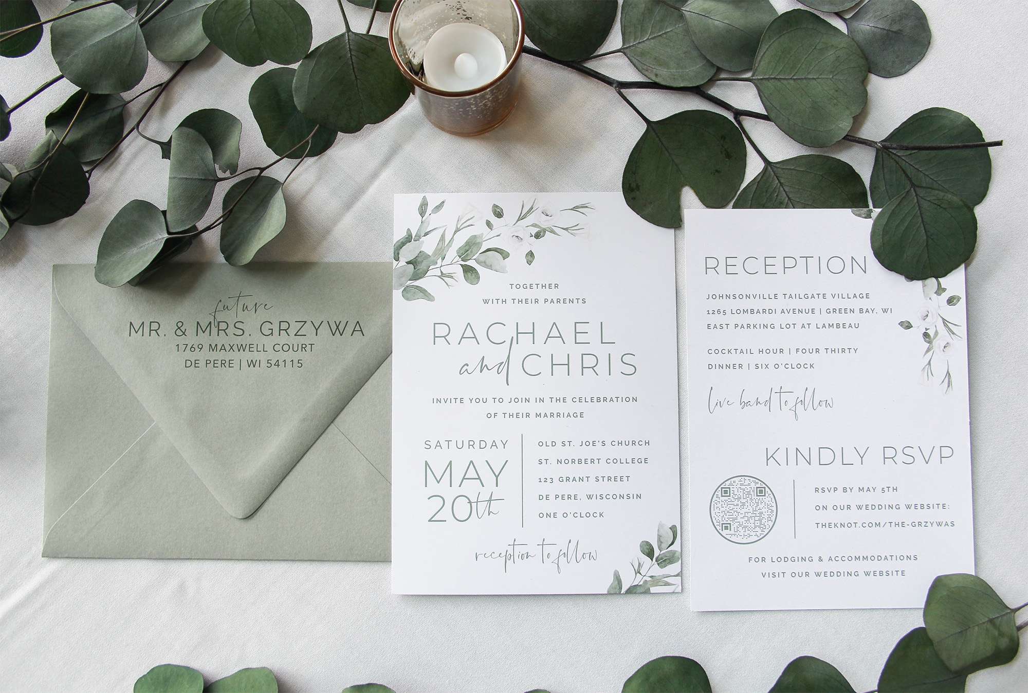 Wedding invitations with sage text and envelope.