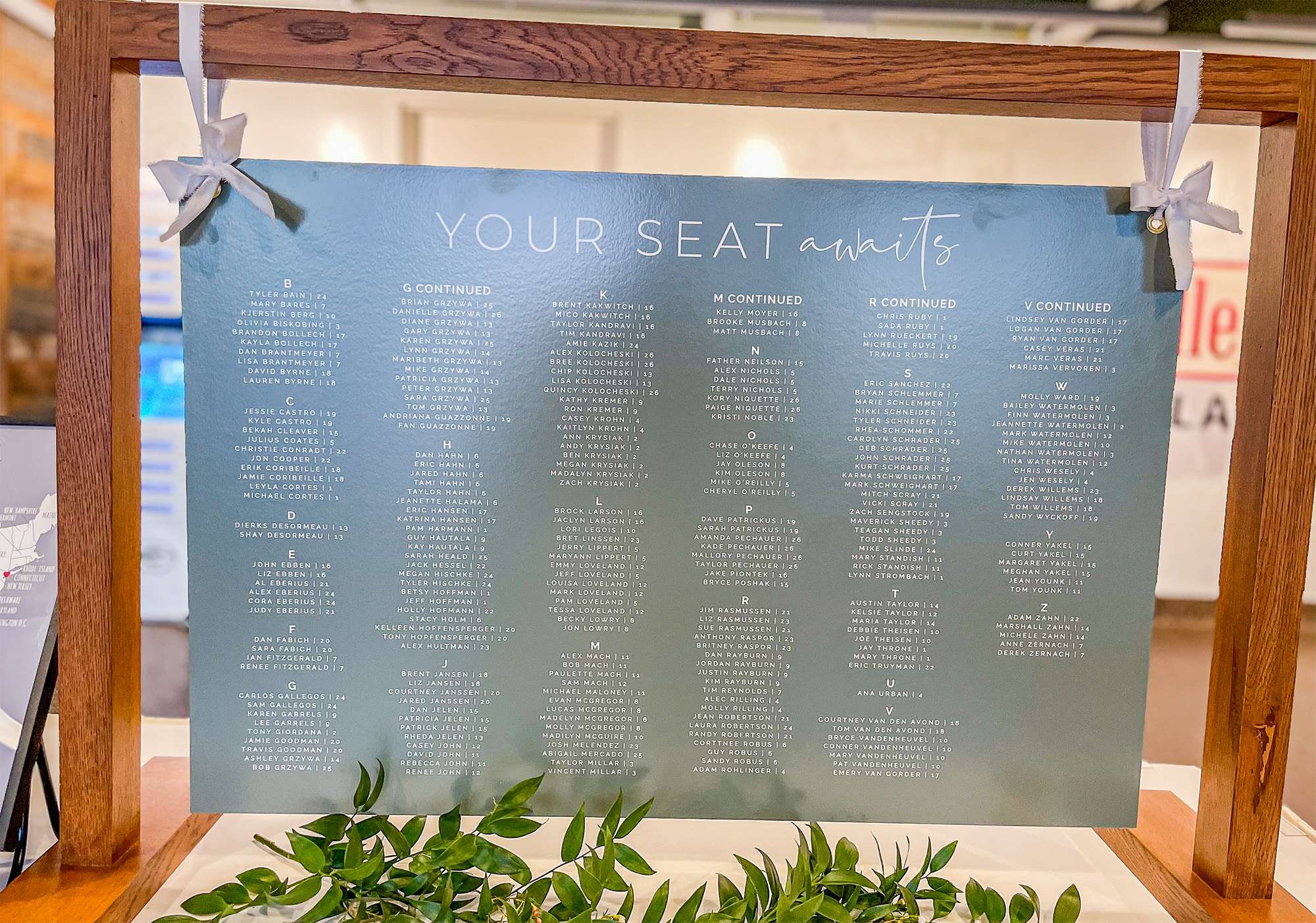 Your seat awaits sign at wedding.
