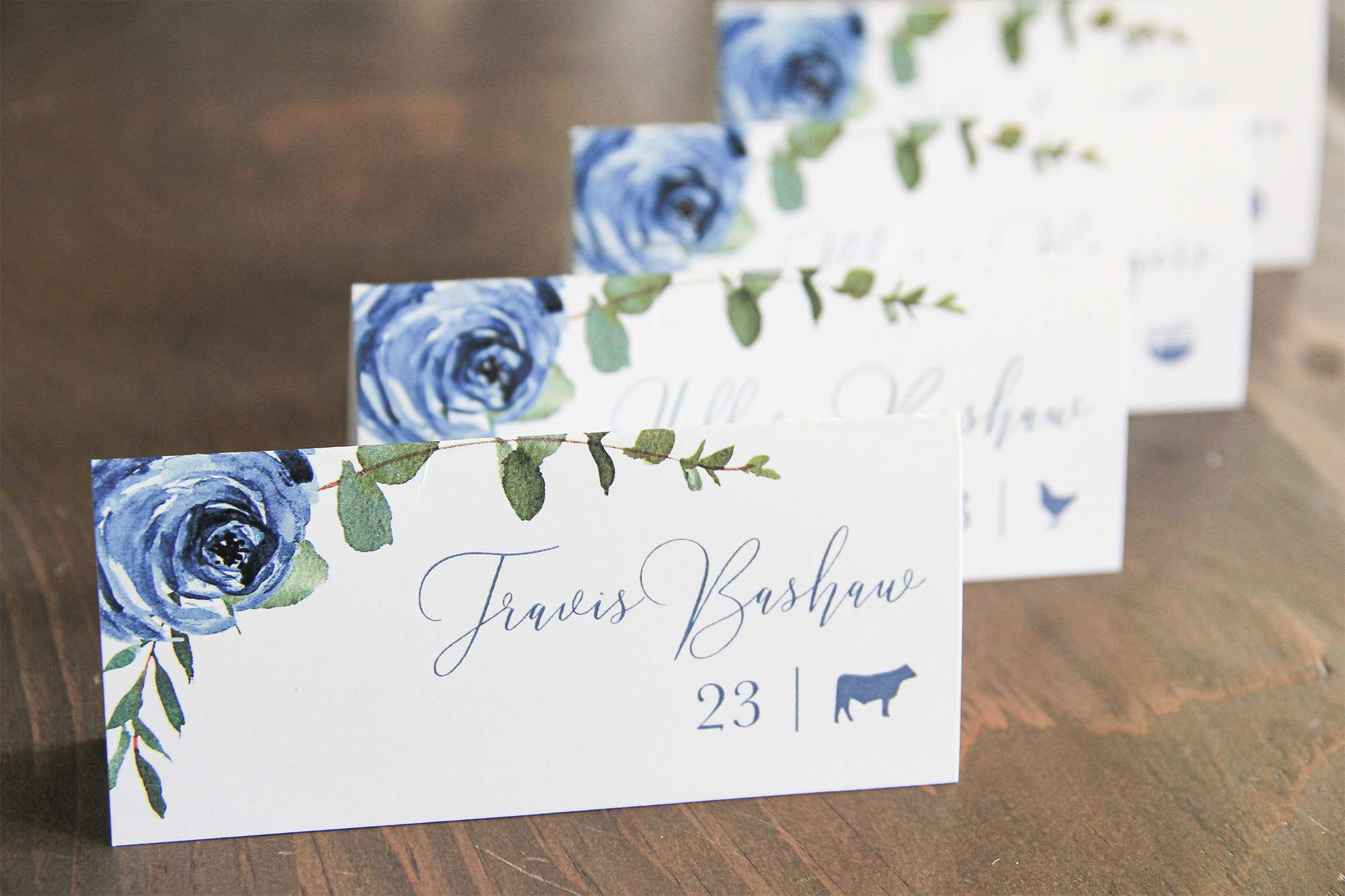 Floral place settings with entree choices in lower right corner by L.designs Custom Wedding Invitations.