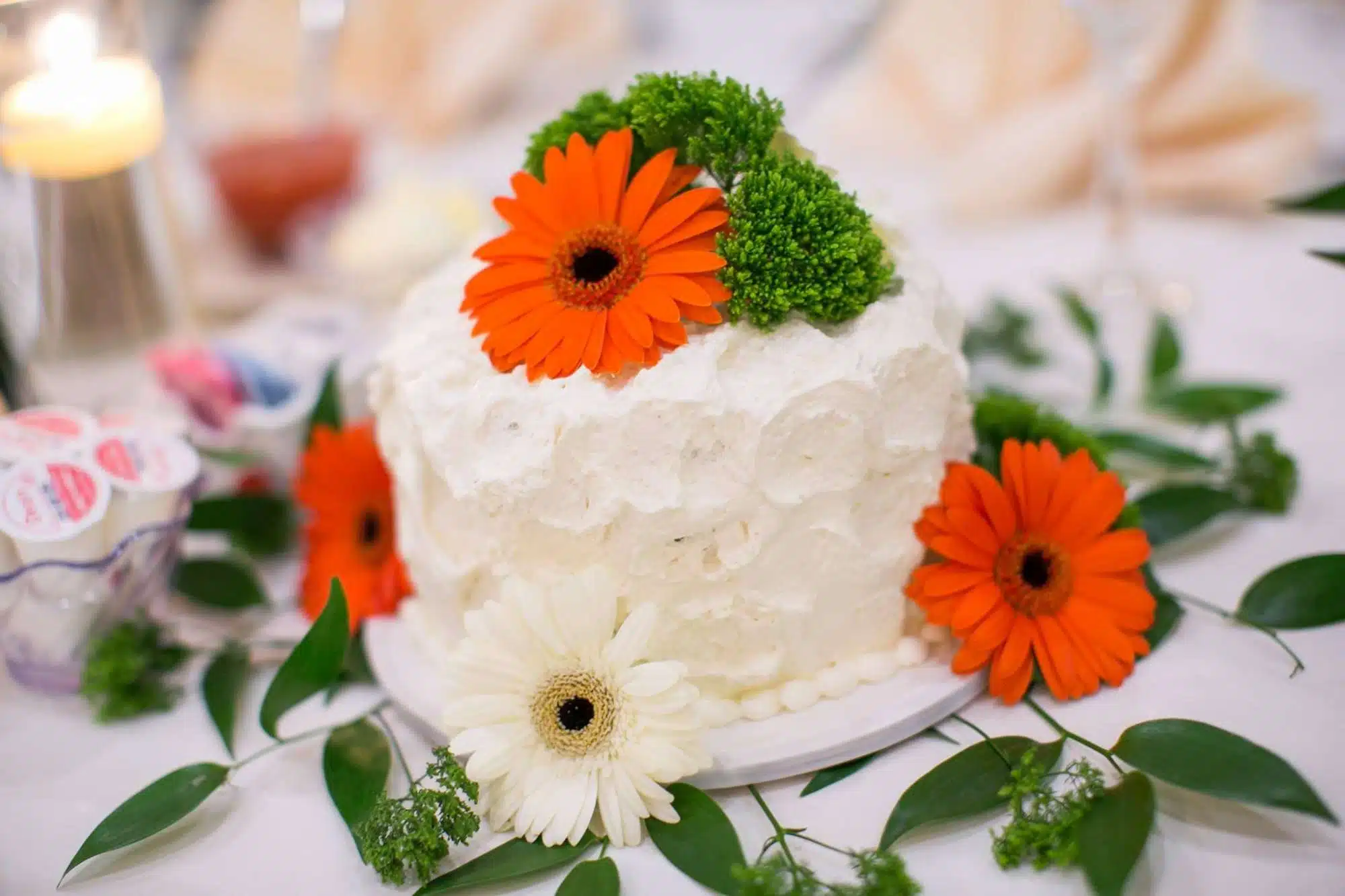 La Sure's Hall Banquet & Catering Custom designed wedding cake with fresh floral accents