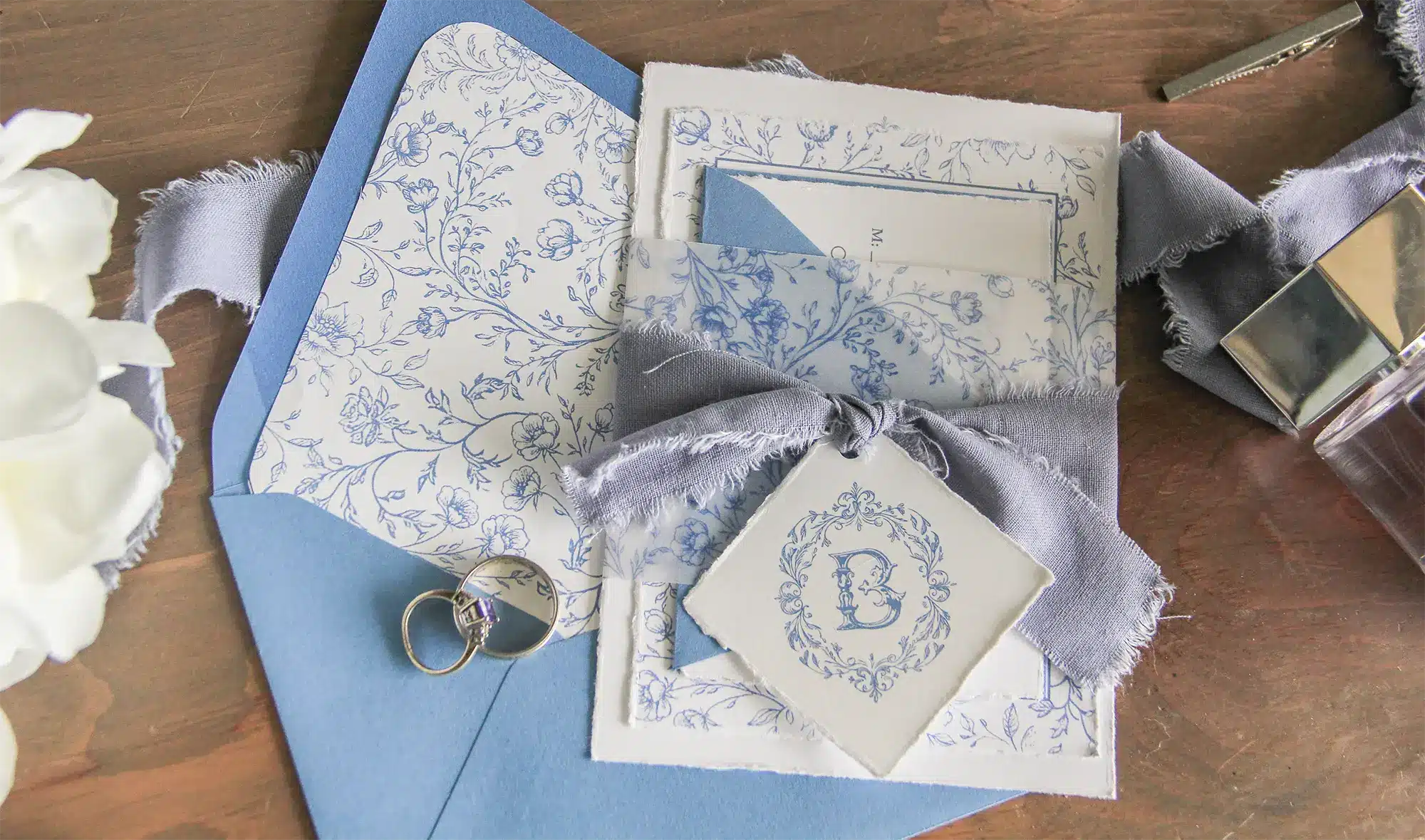 Monogrammed toile invitations in cornflower blue