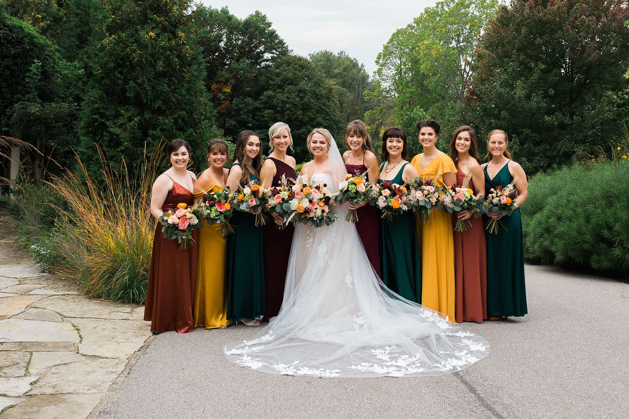 Fall hued bridesmaid gowns at Green Bay Botanical Wedding.