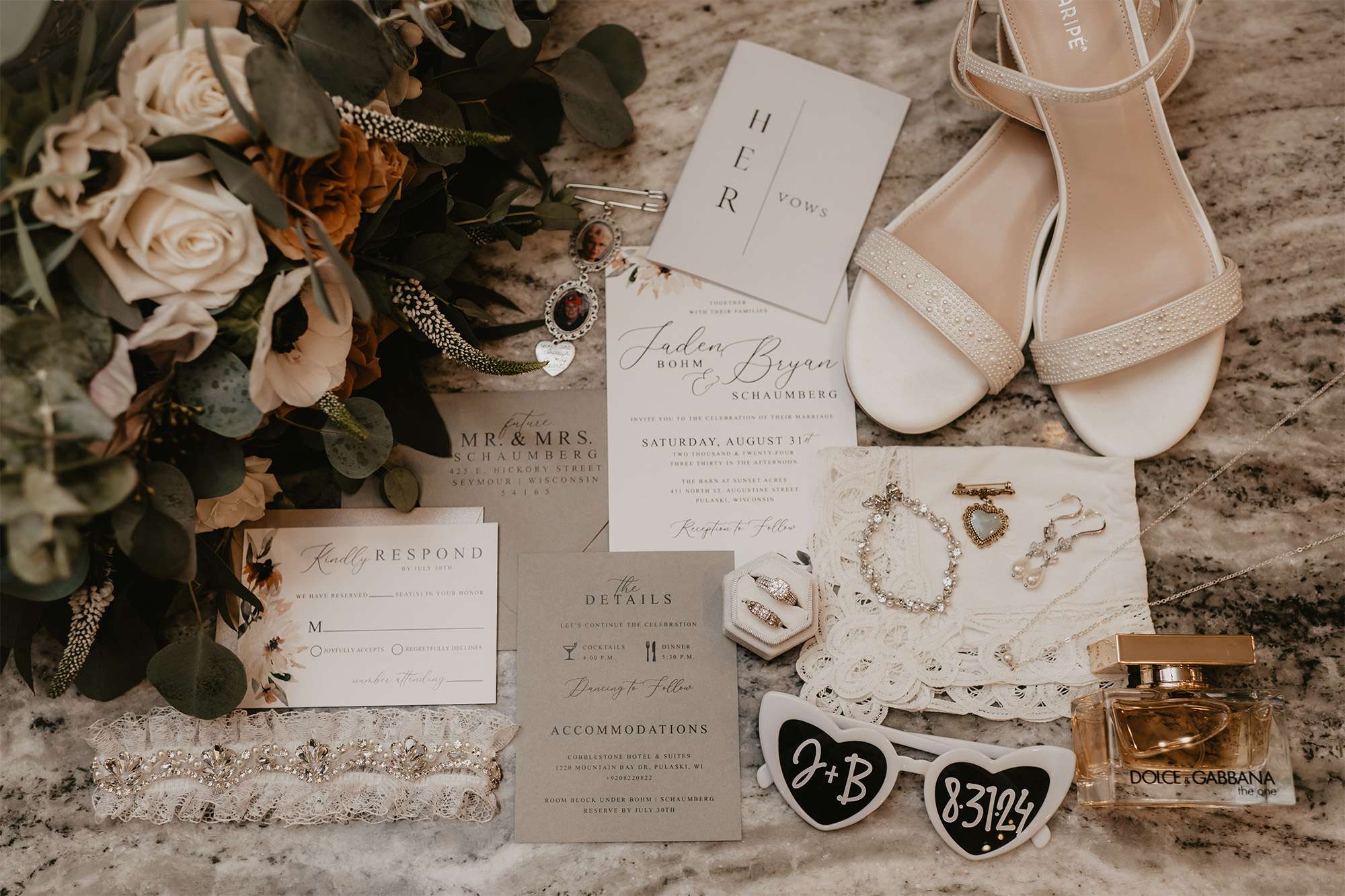 Wedding invitation detail shot, with shoes, sunglasses, rings and perfume