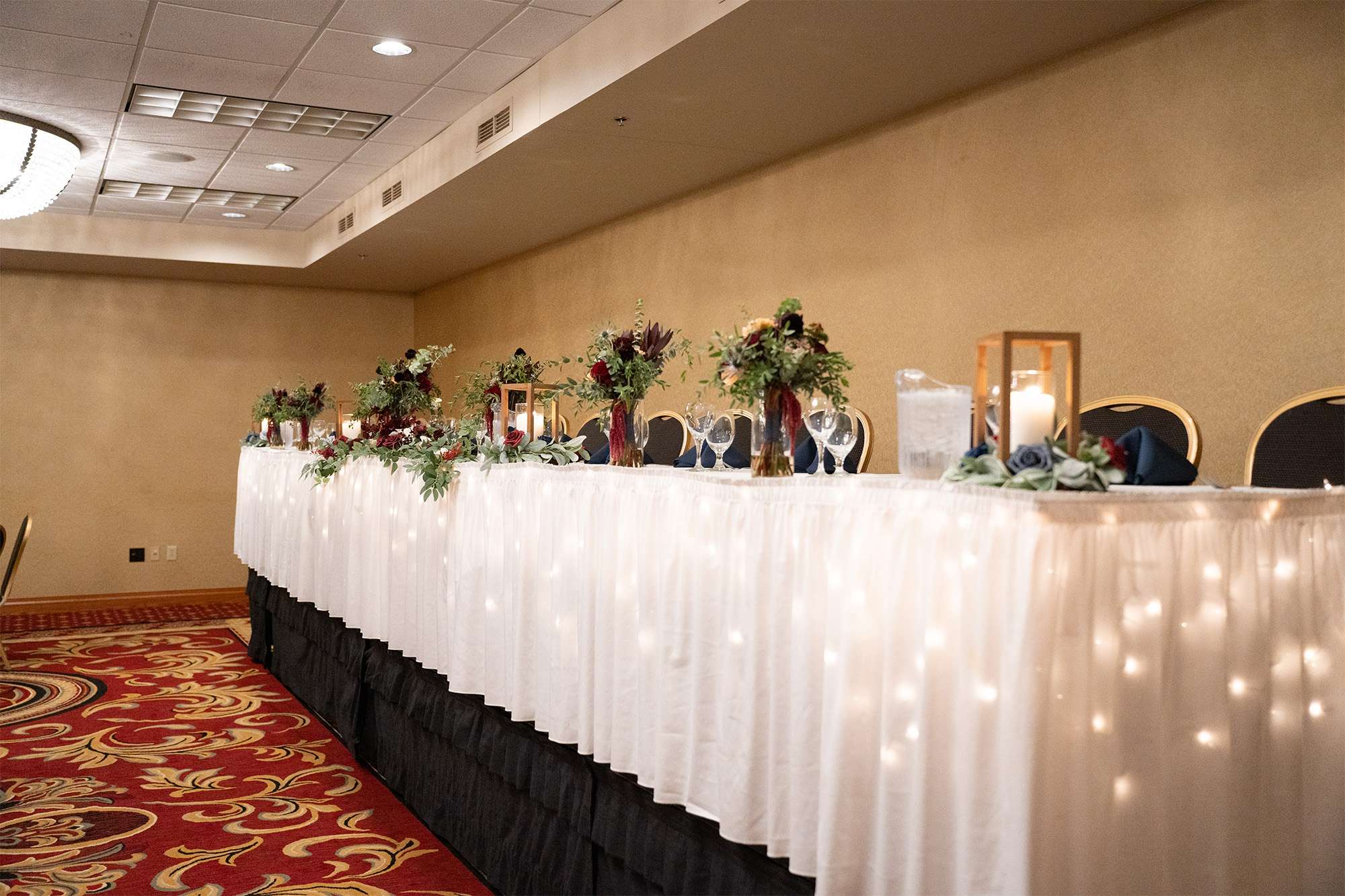 Elevated head lit table at Tundra Lodge wedding reception.