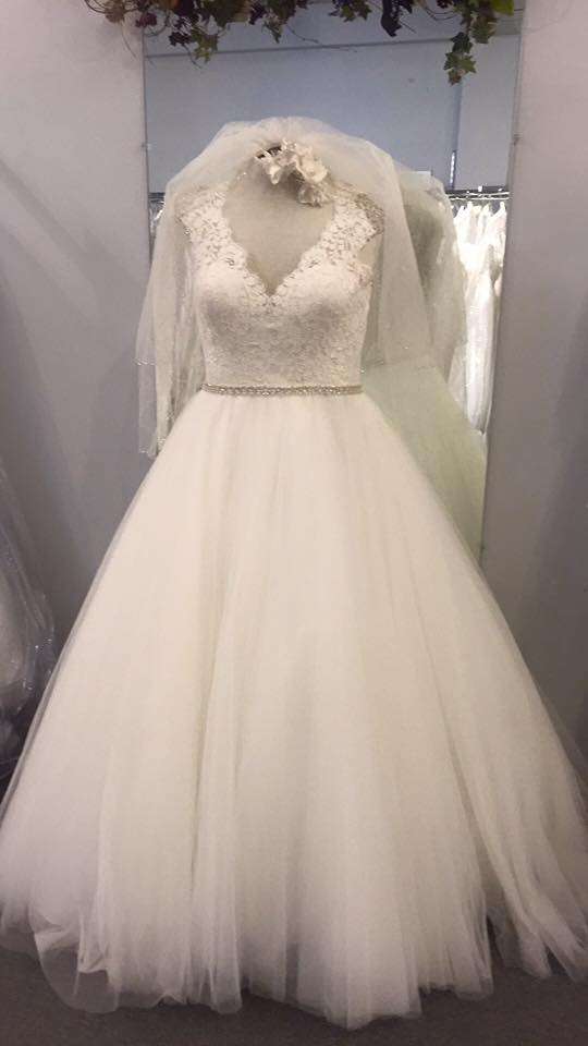 Wedding gown on a form with veil