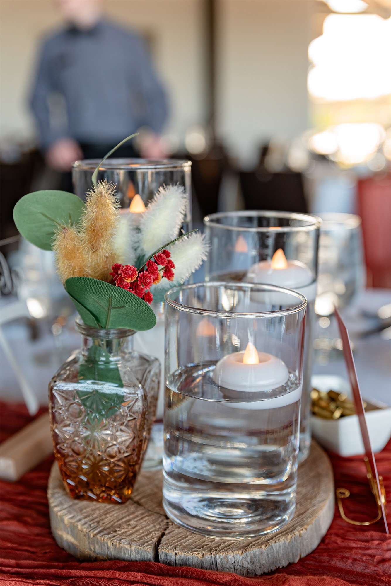 Candles and small floral pieces for reception decoration
