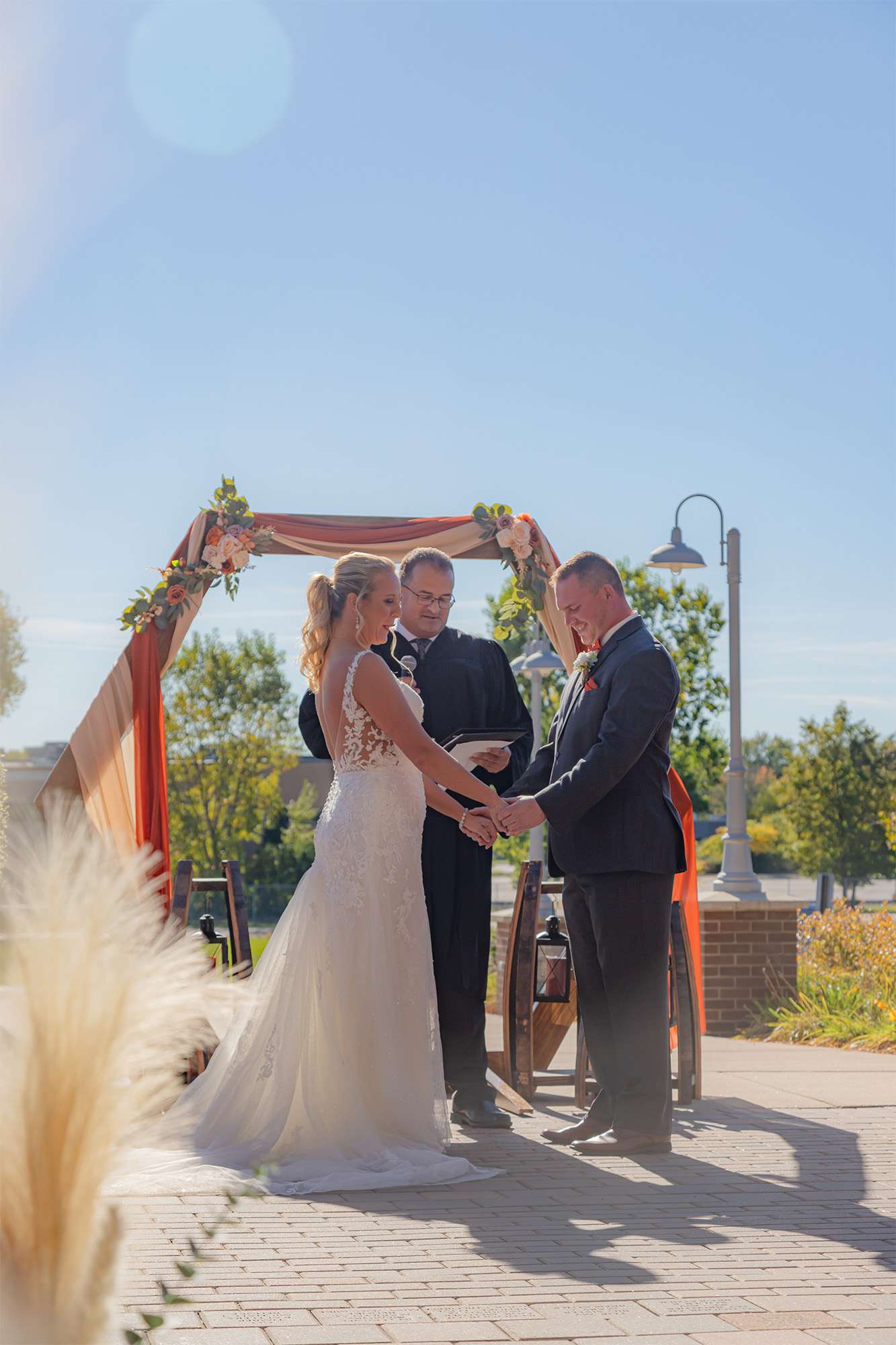 Bride and Groom under Ceremony Arch at the Fox Club