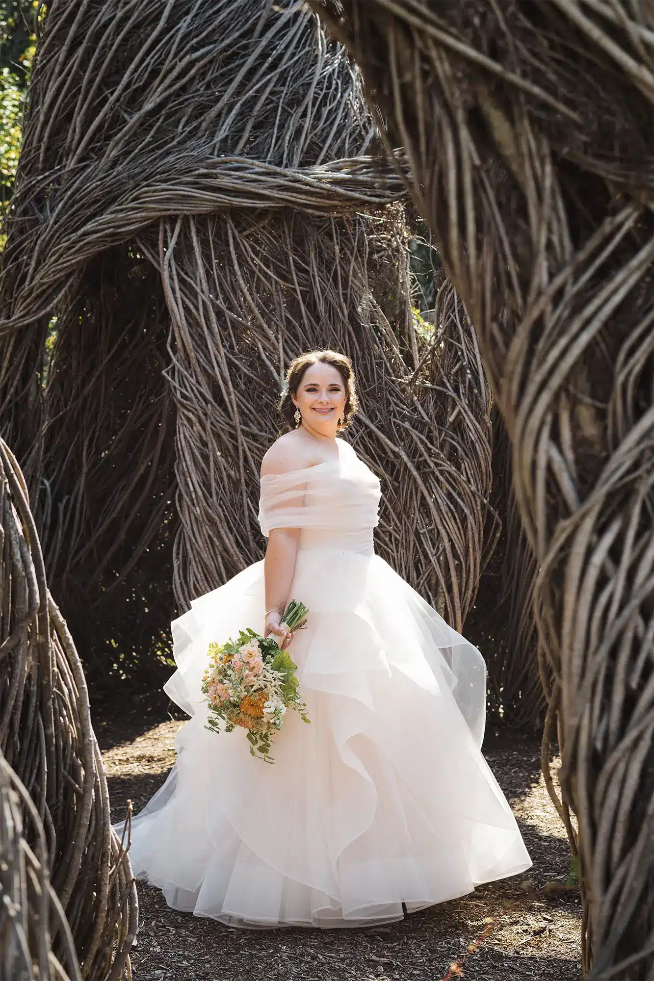 Bride in romantic gown poses at Horseshoe Bay Farms in Door County. Bride in romantic gown poses at Horseshoe Bay Farms in Door County.