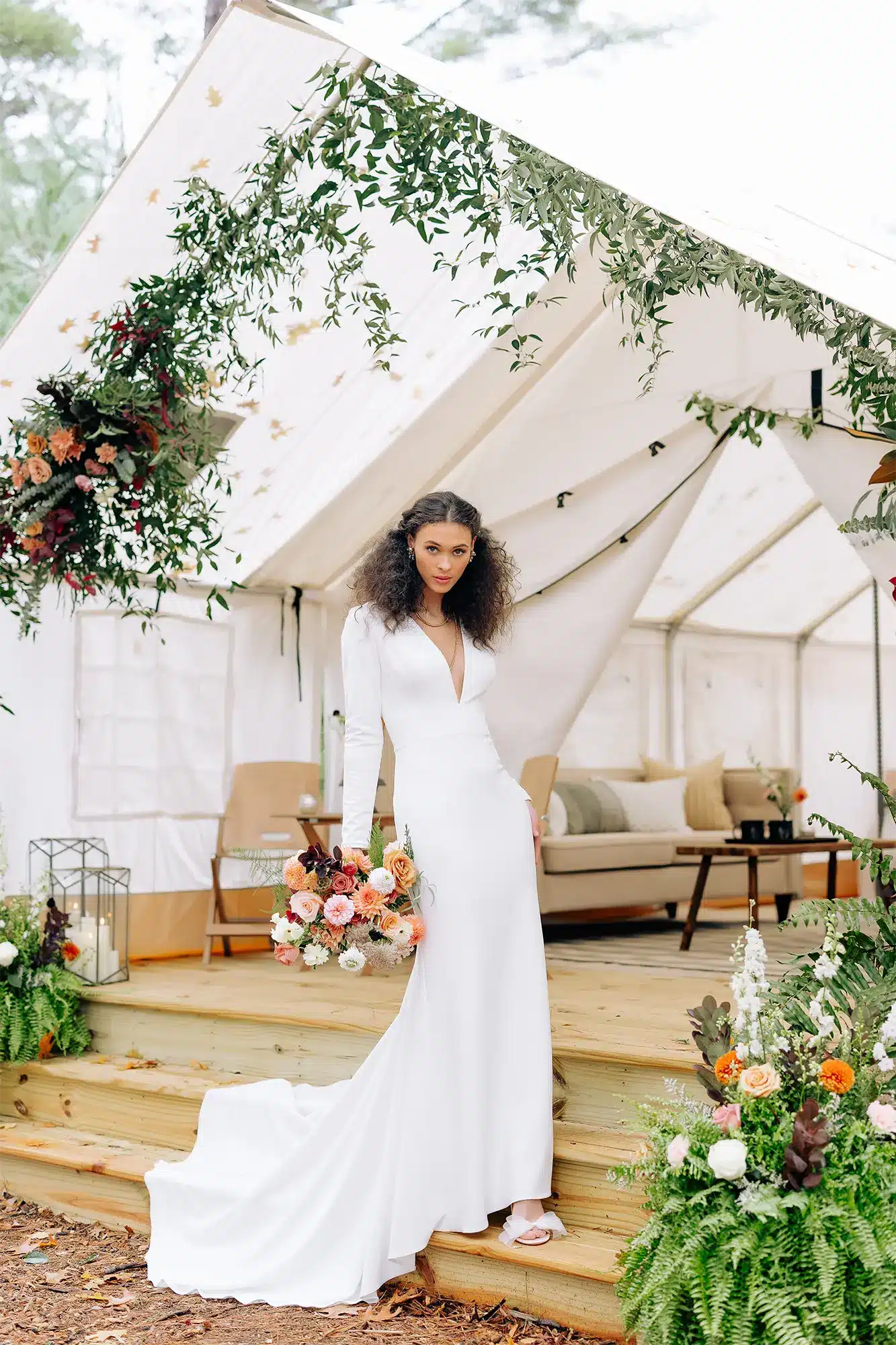 Bride poses with bouquet at Camp Elsewhere in Waupaca. Bride poses with bouquet at Camp Elsewhere in Waupaca.
