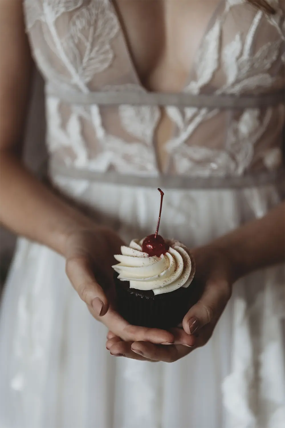 Brandy Old Fashioned Cupcake | The Cupcake Couture. Bride holds Brandy Old Fashioned Cupcake by the Cupcake Couture.