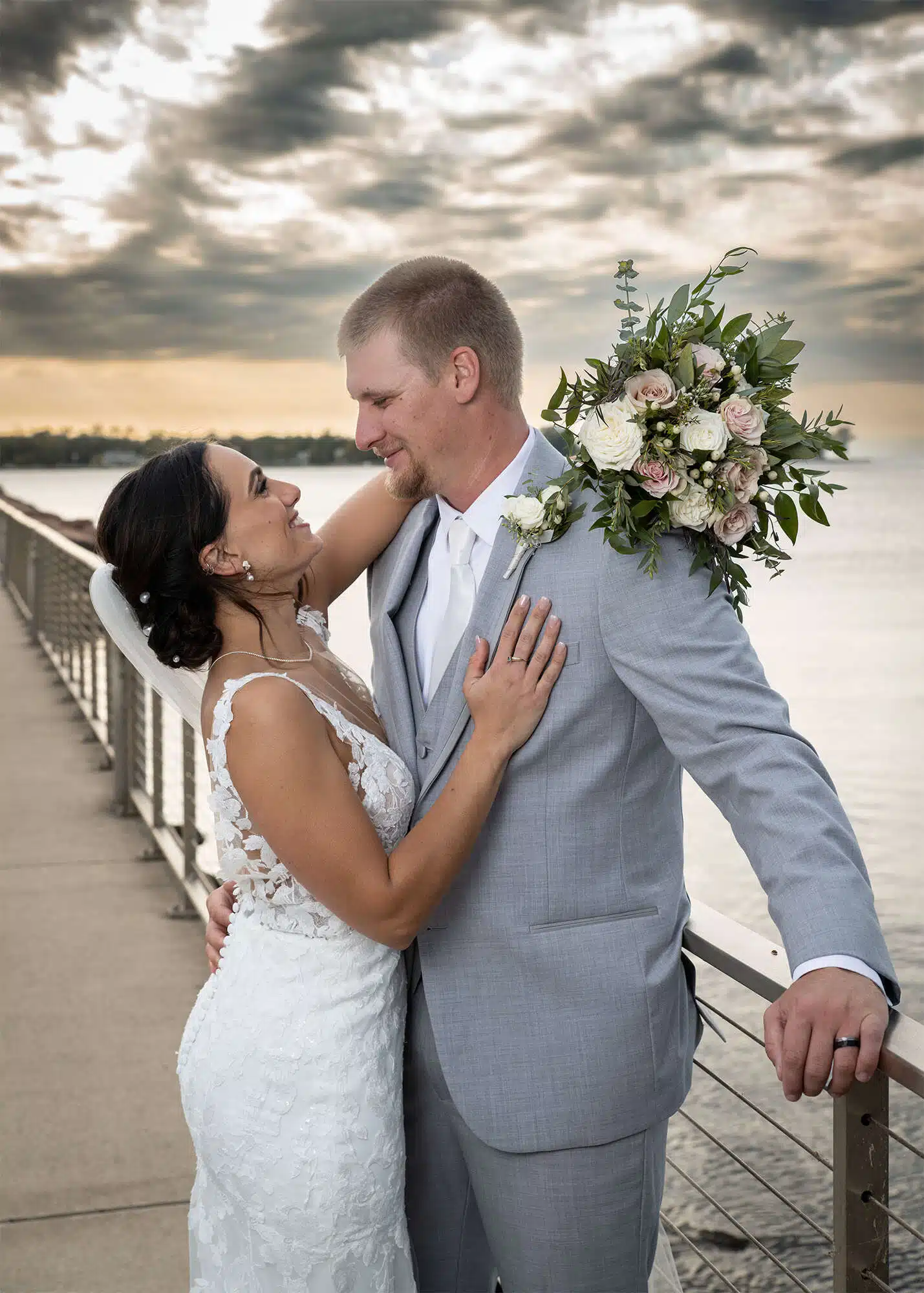 Bride with bouquet and groom at the Egg Harbor Marina