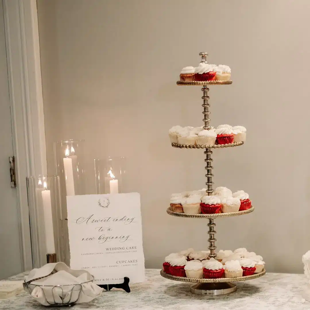 Sweets signage next to silver plated 3 tier decorative cupcake stand by I Do Decorating & Rental Service