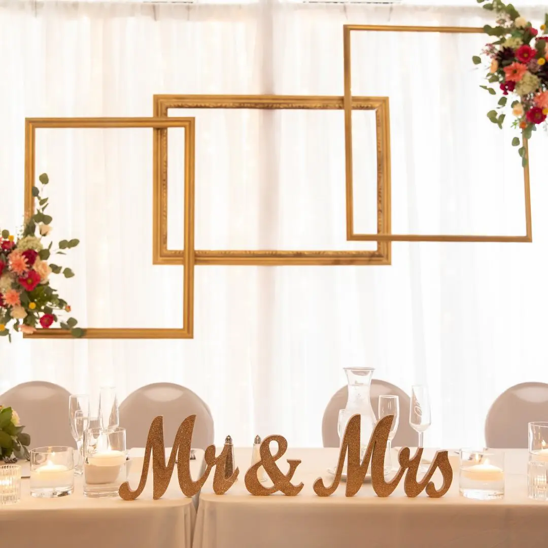 Elegant backdrop design with gold frames adorned with flowers created by