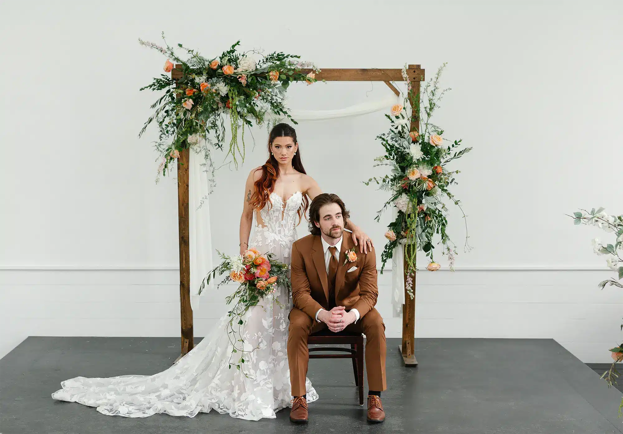 Bride with bouquet from uBloom Oshkosh and groom.