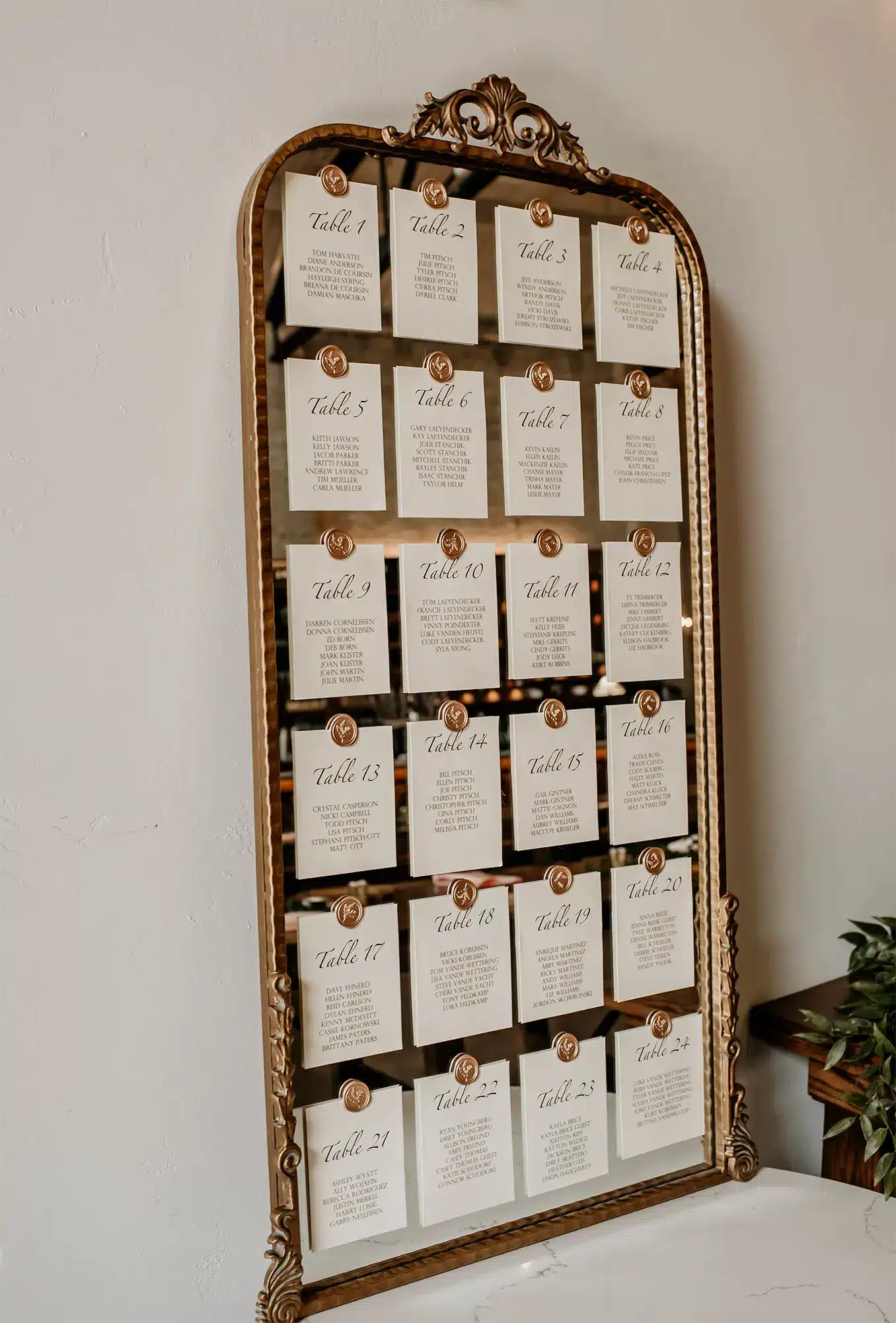 Elegant seating chart on vintage mirror. Elegant seating chart on vintage mirror.