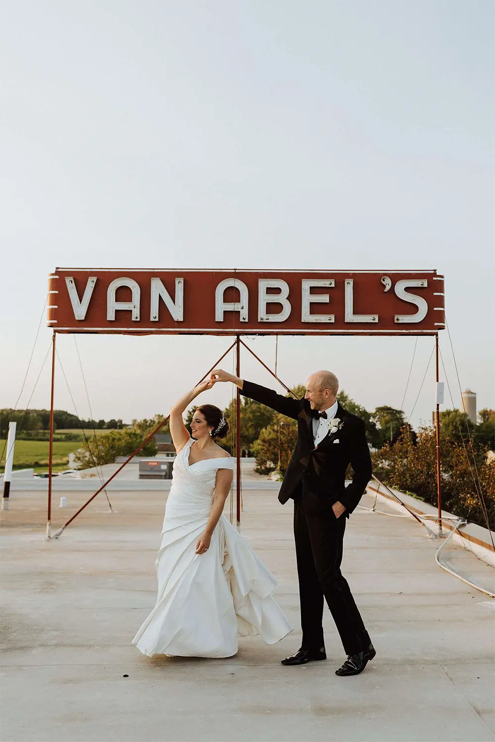 Bride and groom dance on roof at Van Abel’s. Bride and groom dance on roof at Van Abel's.