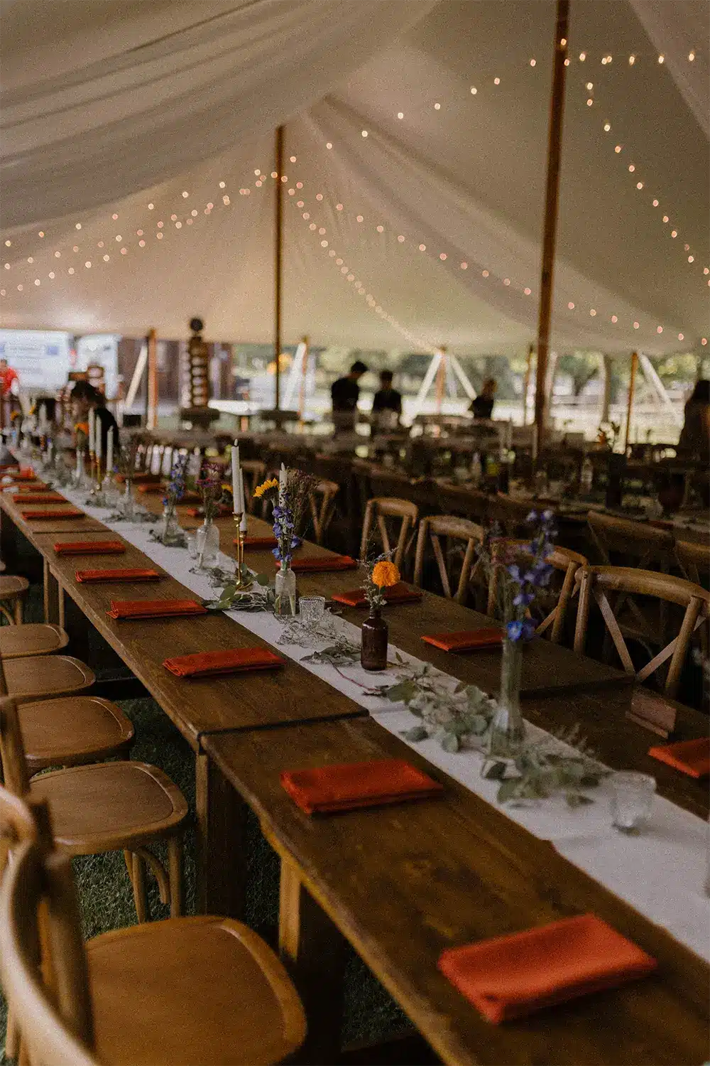 Tented wedding with wooden farm tables at Heritage Hill. Tented wedding with wooden farm tables at Heritage Hill.