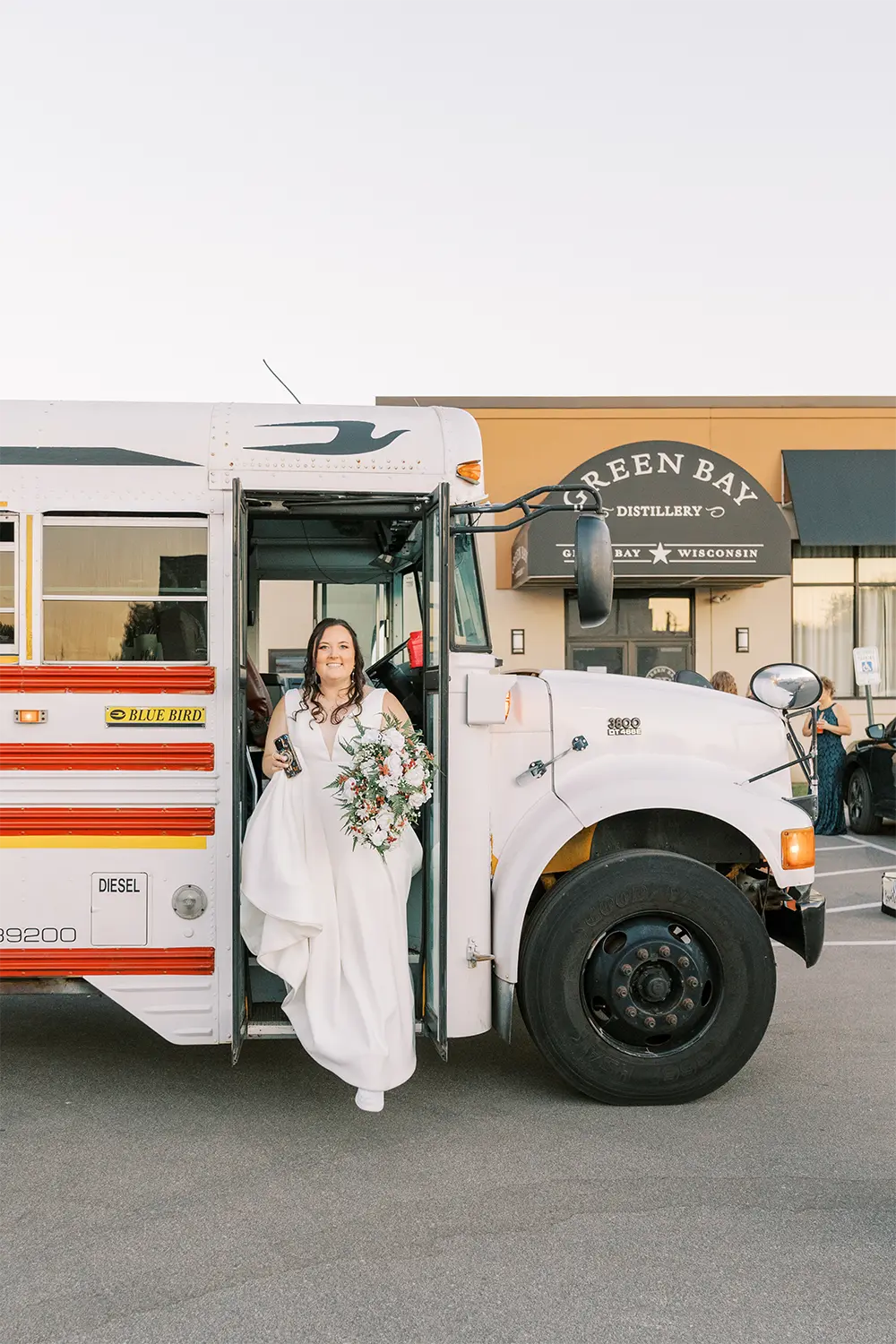Bride exits party bus at the Green Bay Distillery. Bride exits party bus at the Green Bay Distillery.