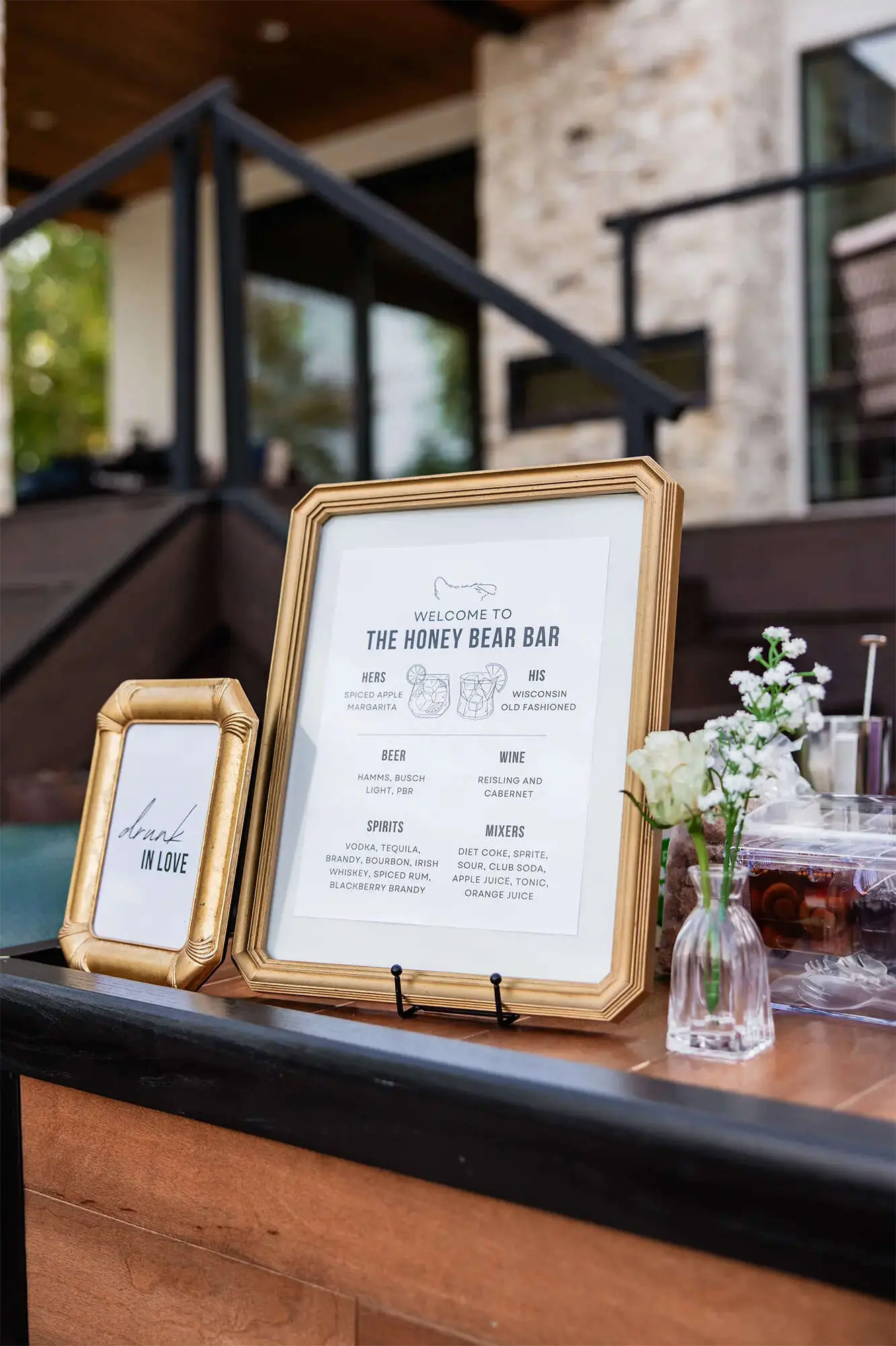 Clintonville-lakeside-wedding-reception-10 Welcome to the Honey Bear Bar custom signage in gold frame atop wood bar