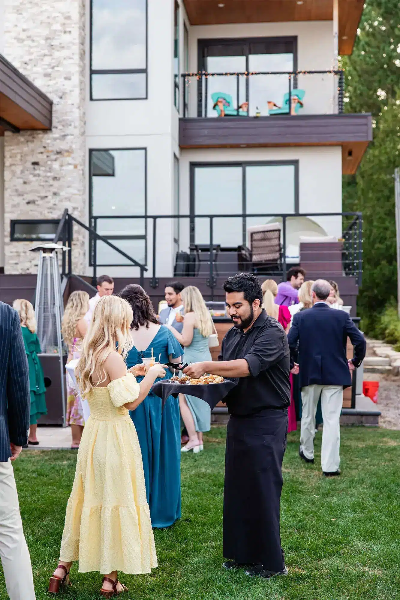 Clintonville-lakeside-wedding-reception-40 Chive's server offering hors d'oeuvres to guests