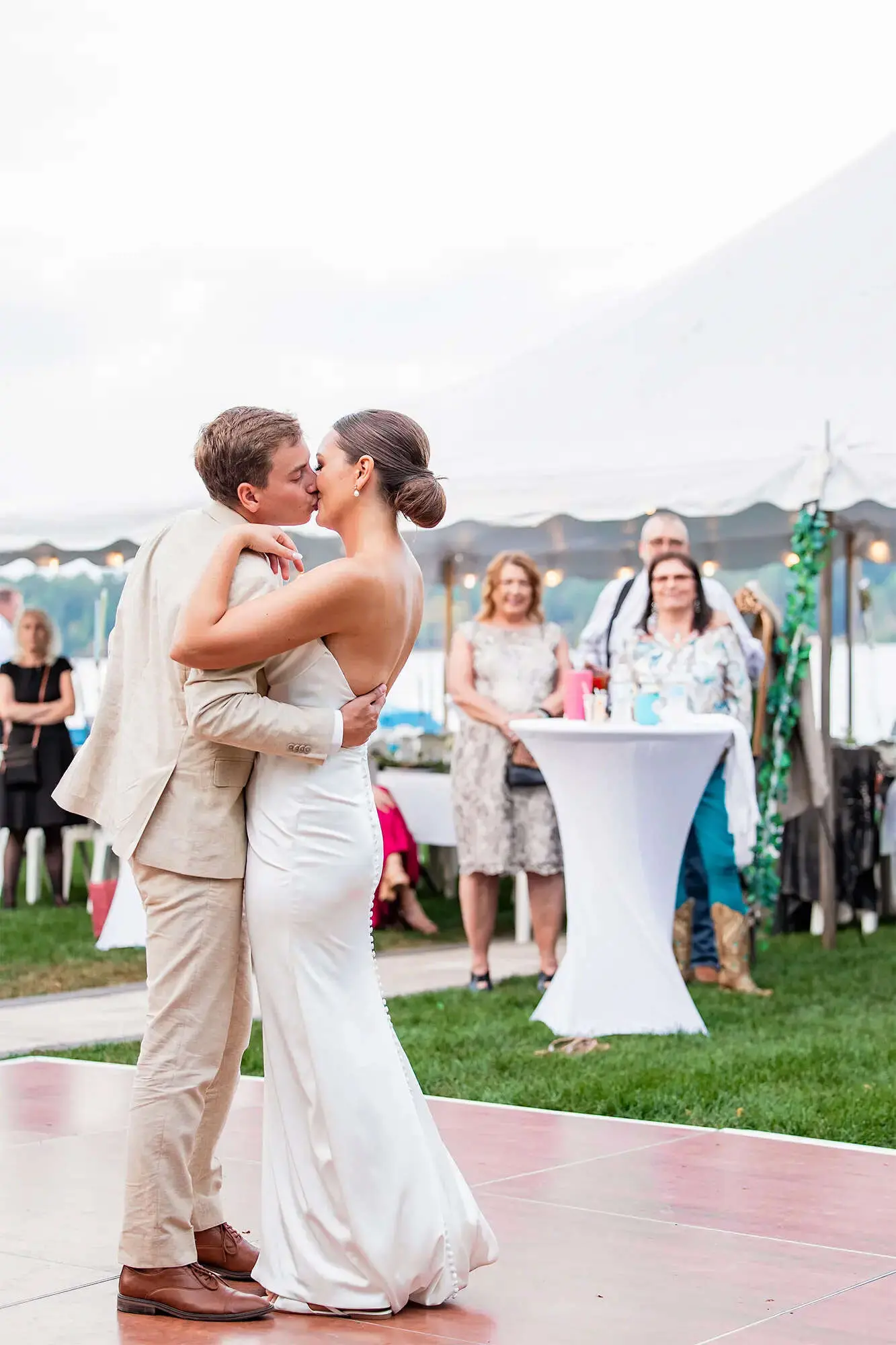 Clintonville-lakeside-wedding-reception-51 Couple sharing kiss during first dance