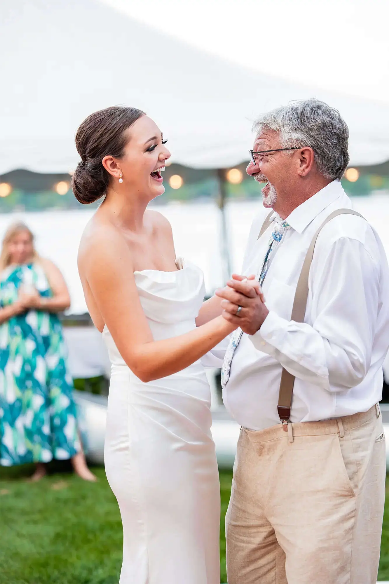 Clintonville-lakeside-wedding-reception-57 bride and father laughing as they share a dance