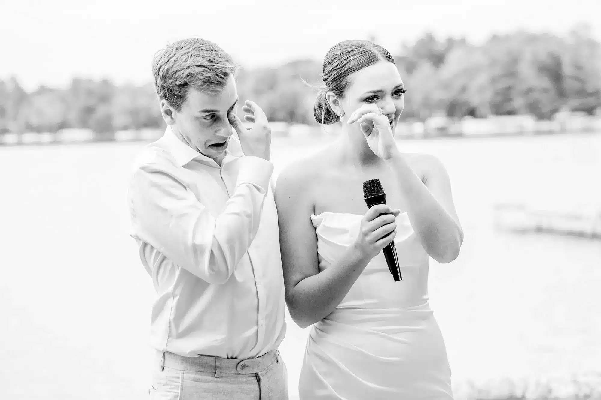 clintonville-lakeside-wedding-reception-69 Couple shedding tears up as bride holds microphone