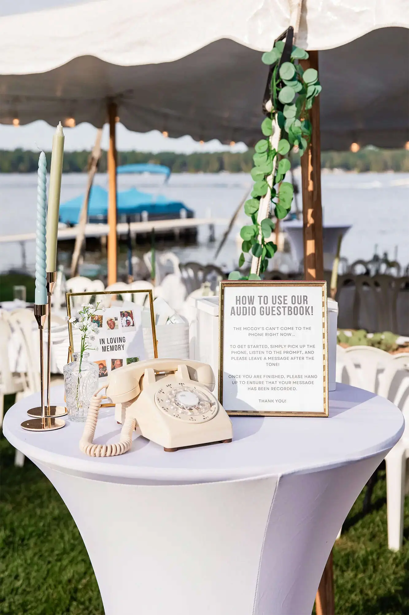 Clintonville-lakeside-wedding-reception-8 Ivory Telephone guestbook on table with loved ones passed photos
