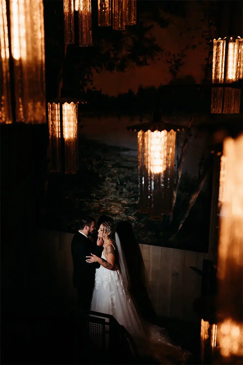 Bride and groom pose in stairway at Stevens Point wedding. Bride and groom pose in stairway at Stevens Point wedding.