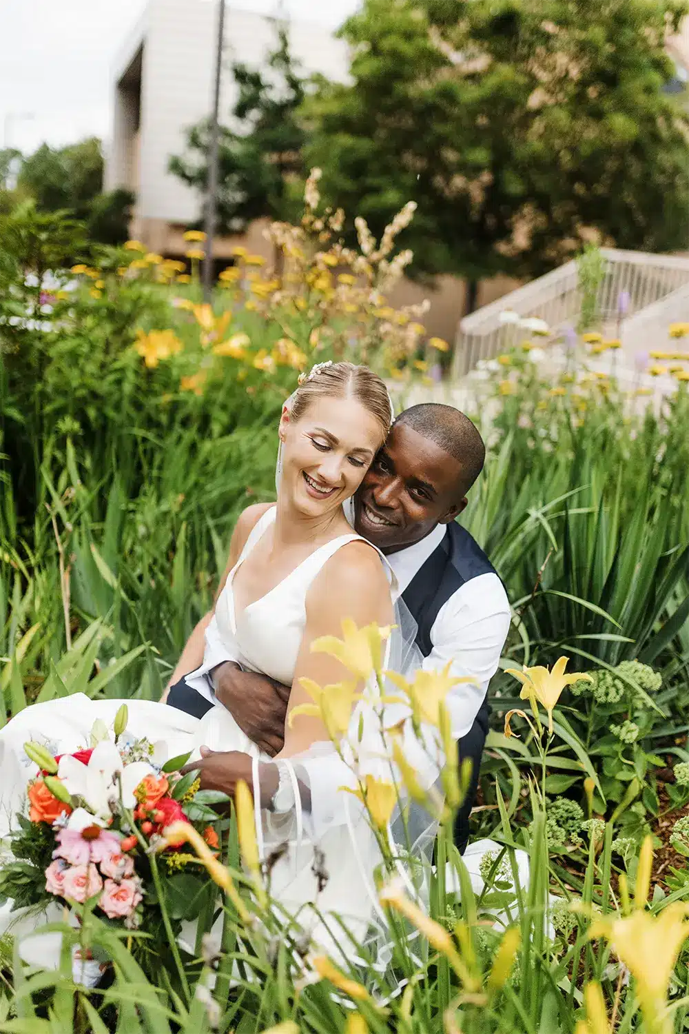 Bride and groom pose in the Iris Garden at UW Stevens Point. Bride and groom pose in the Iris Garden at UW Stevens Point.