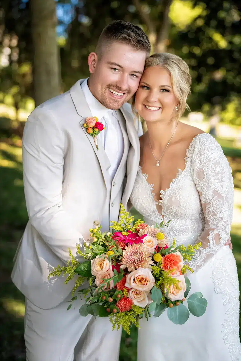 Kylie and Trevor pose with her vibrant bouquet at the Heidel House Hotel. Kylie and Trevor pose with her vibrant bouquet at the Heidel House Hotel.