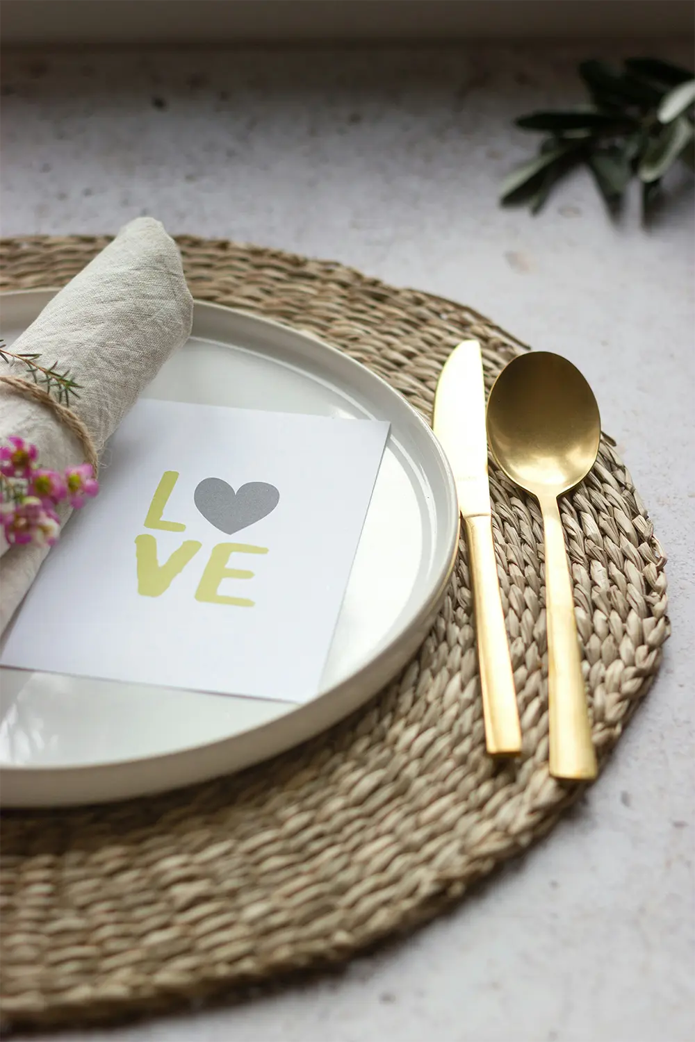 Place setting with love card placed on plate. Place setting with love card placed on plate.