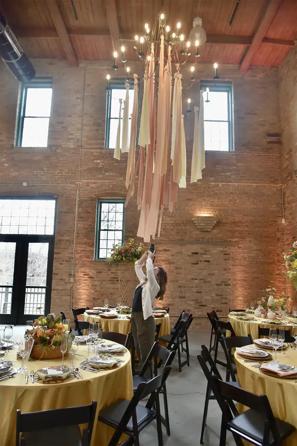 Videographer films details at wedding reception. Videographer films details at wedding reception.