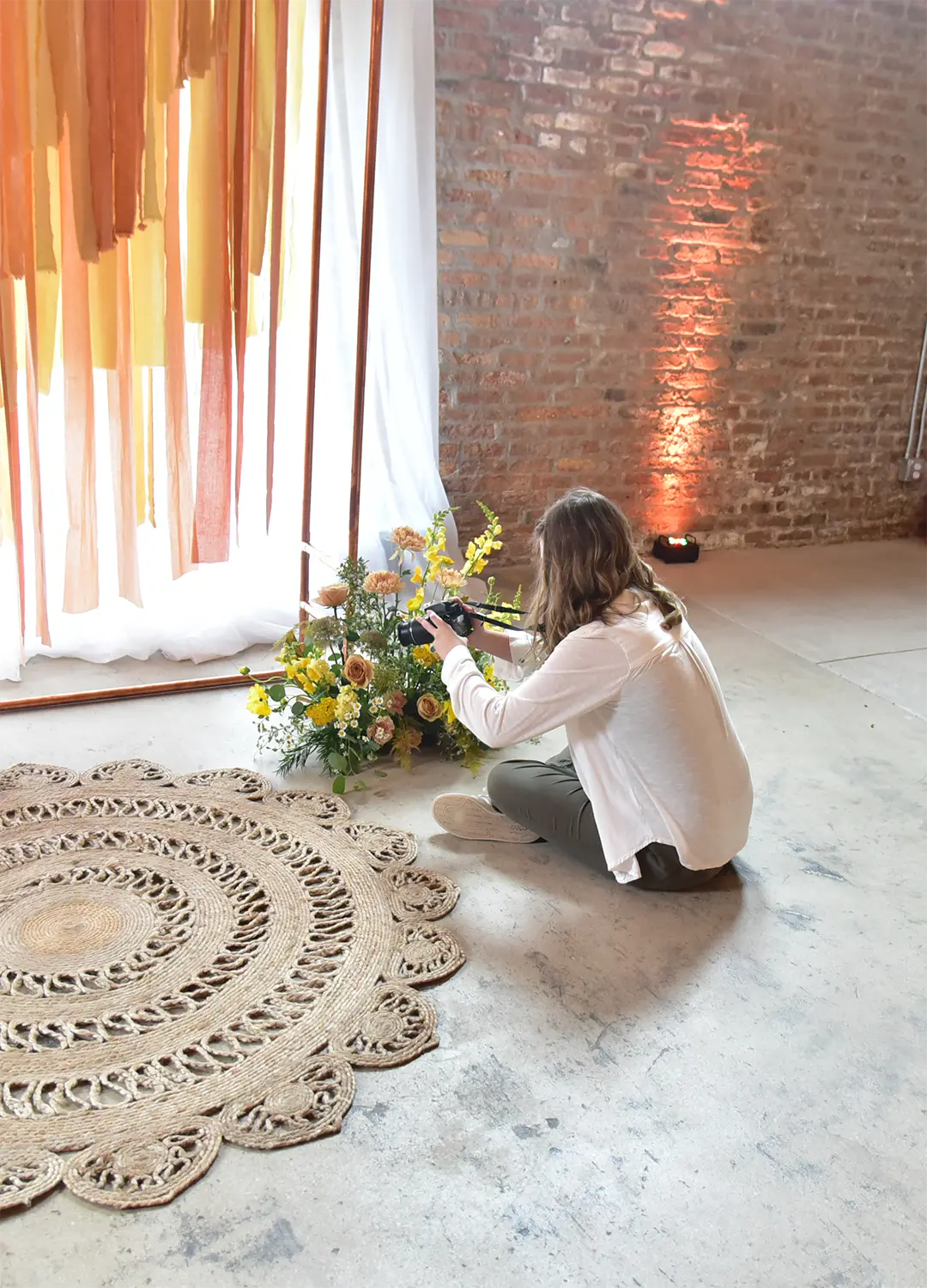 Videographer films floral details at styled wedding shoot. Videographer films floral details at styled wedding shoot.