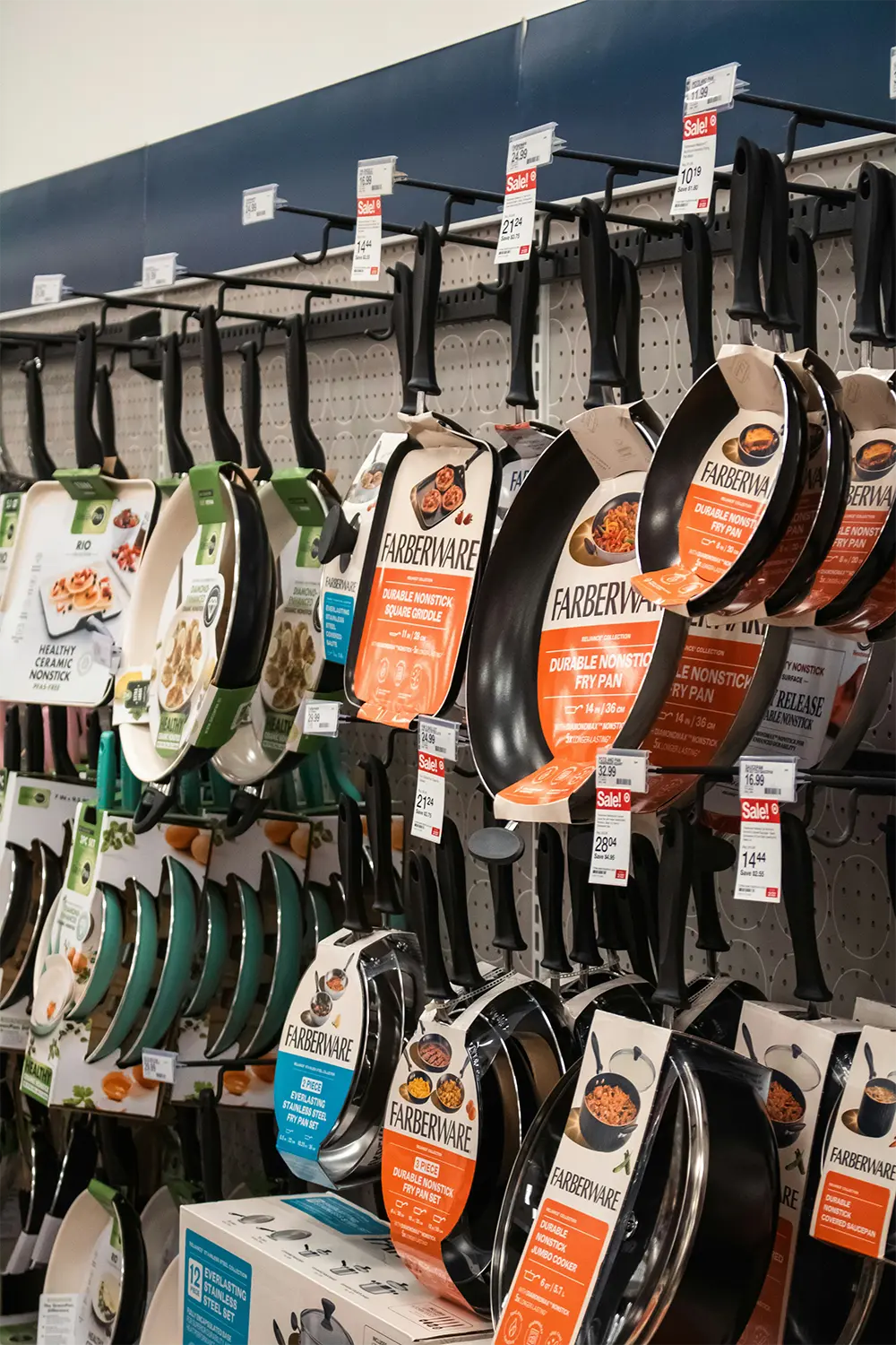 Pans hanging on wall at store. Pans hanging on wall at store.