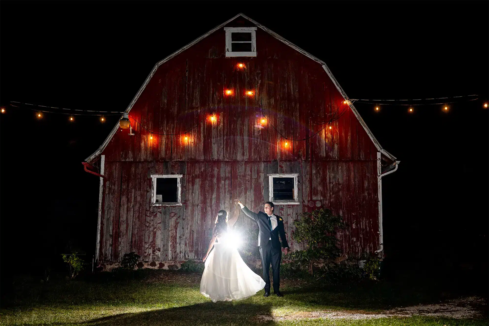 Bride and groom dance for their end-of-night, backlit shot from Sam Lauersdorf Photography. Bride and groom dance for their end-of-night, backlit shot from Sam Lauersdorf Photography.