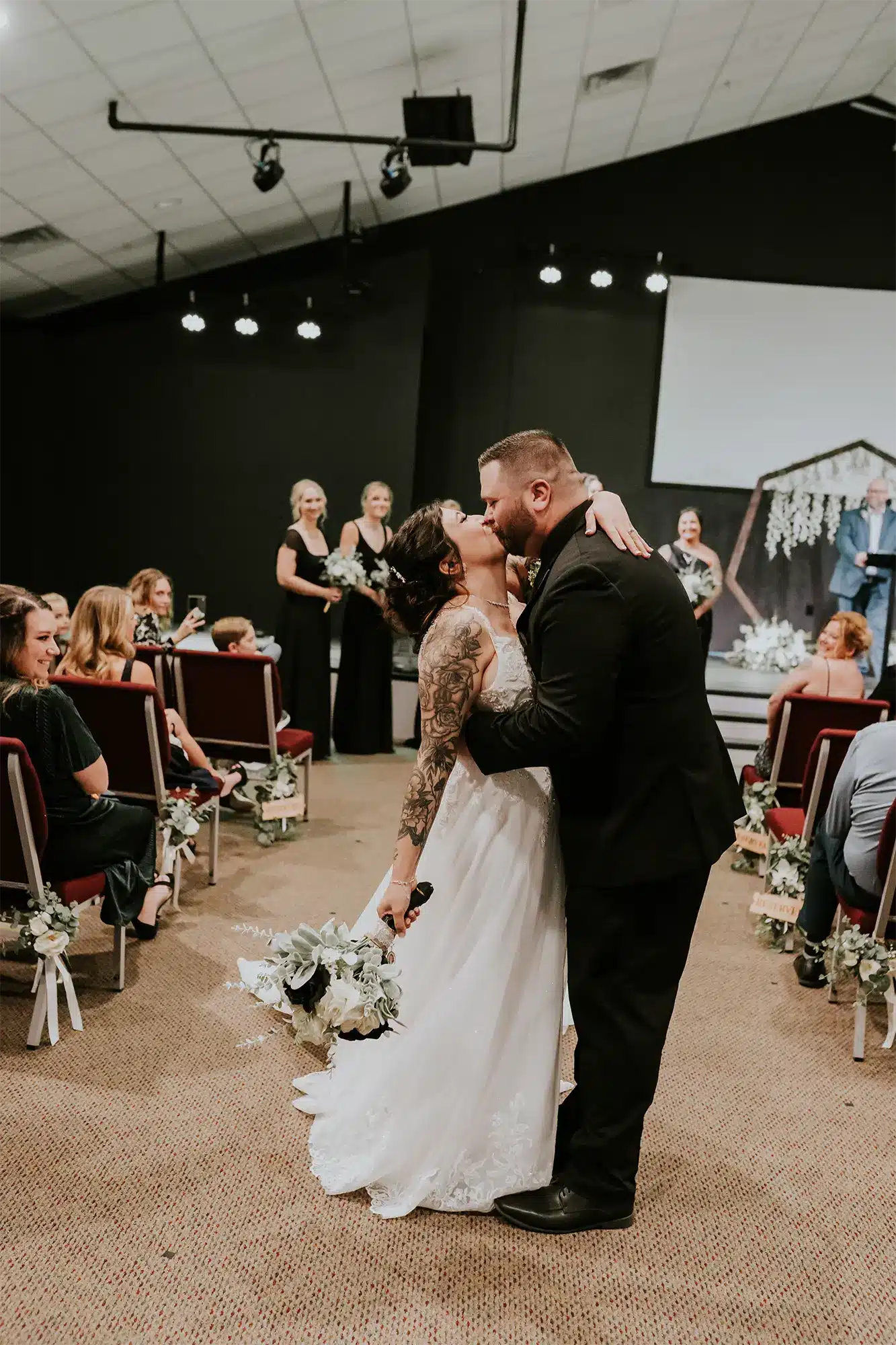 Brianna and Cody stop and kiss on their way back up the aisle at Simply Church in Suamico. Brianna and Cody stop and kiss on their way back up the aisle at Simply Church in Suamico.