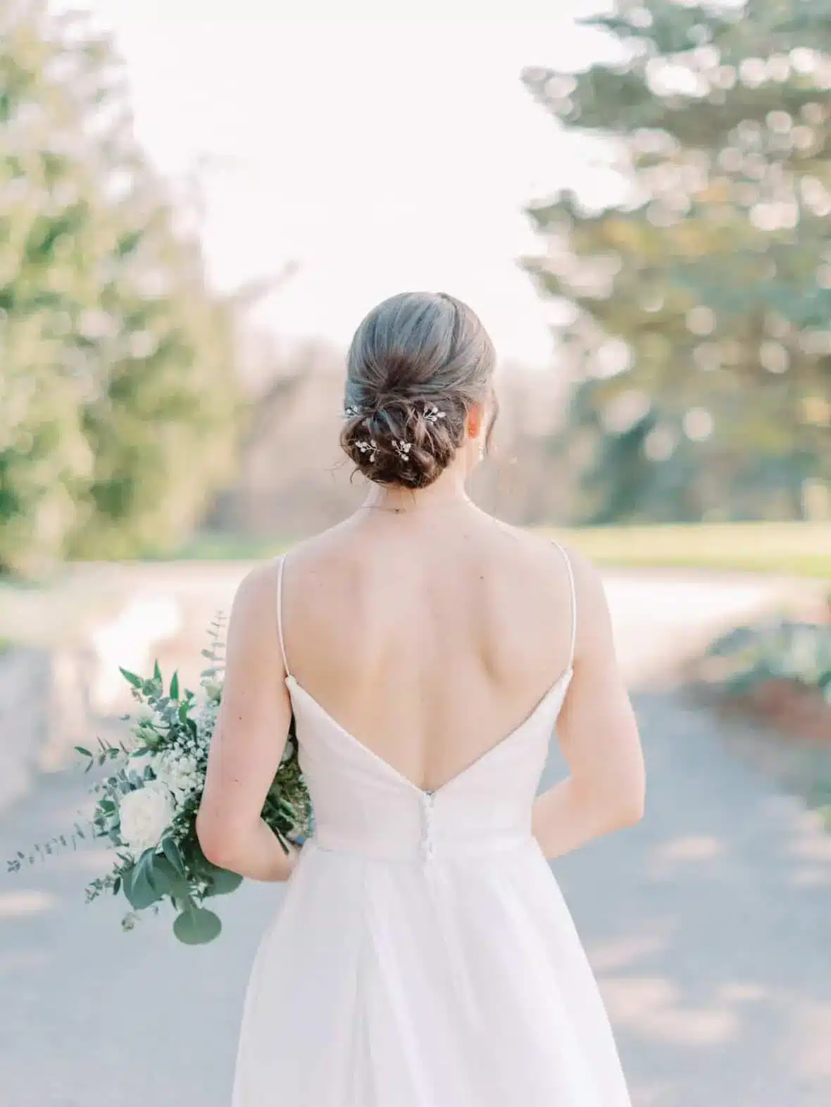 Bride in chic low bun.