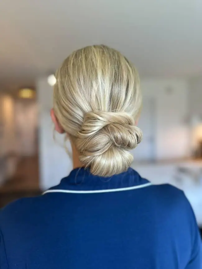 Blonde woman with elegant low bun.