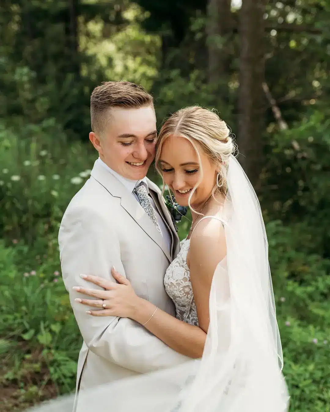Bride in veil with wispy curls.