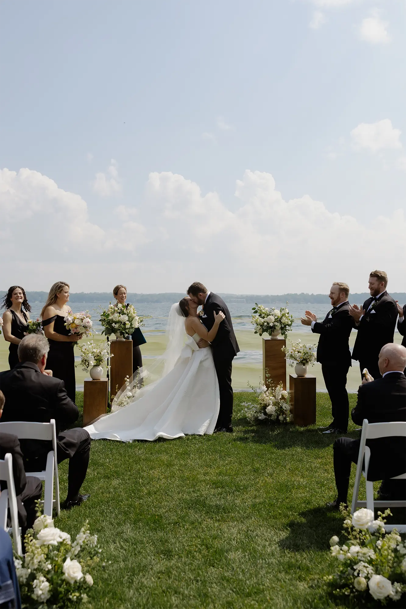 Sealed with a kiss on Green Lake Bride and groom kiss at the conclussion of thier wedding ceremony on Green Lake .