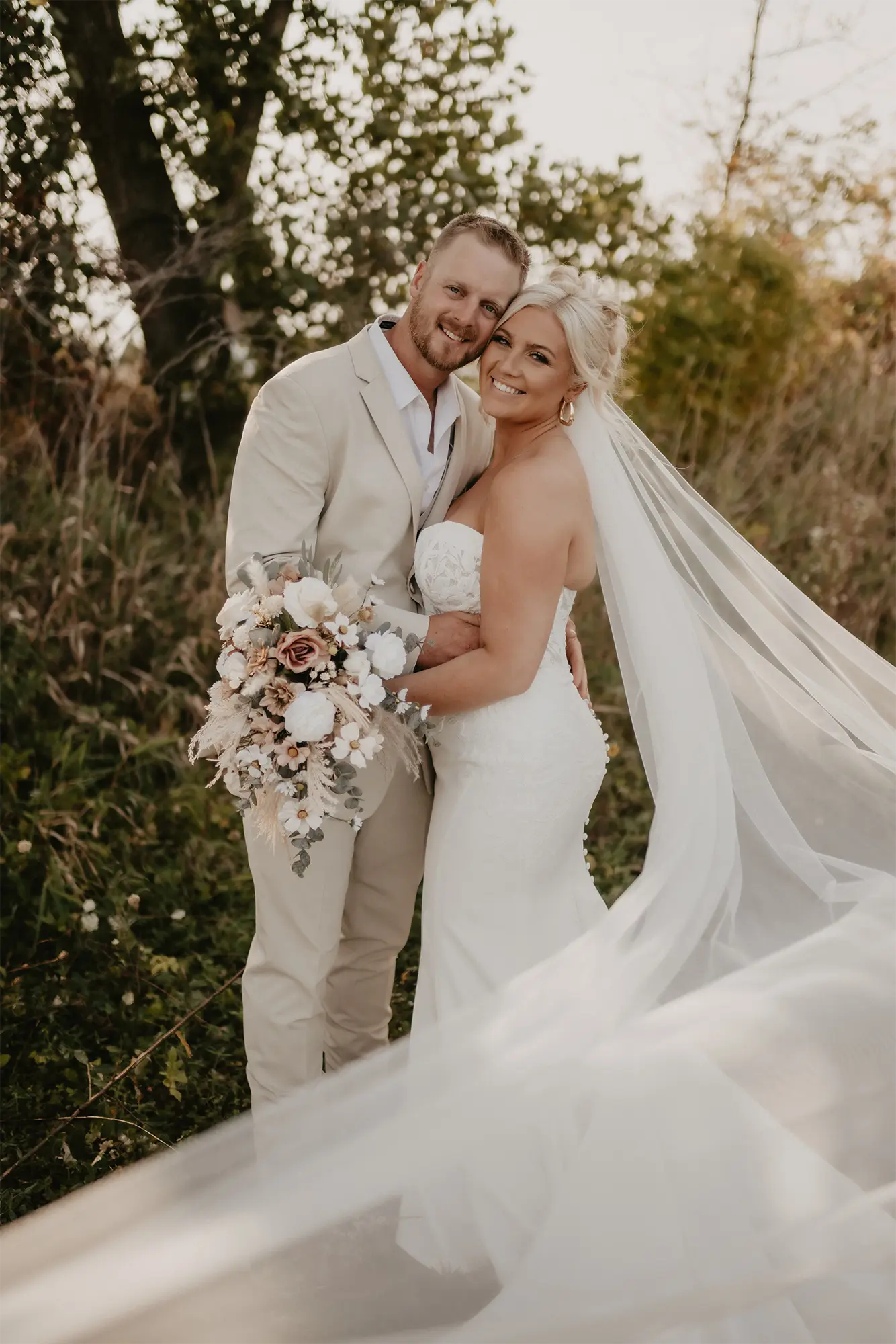 Romantic Couple Portrait Bride and groom pose with bouquet in natural outdoor setting at Stone Prairie
